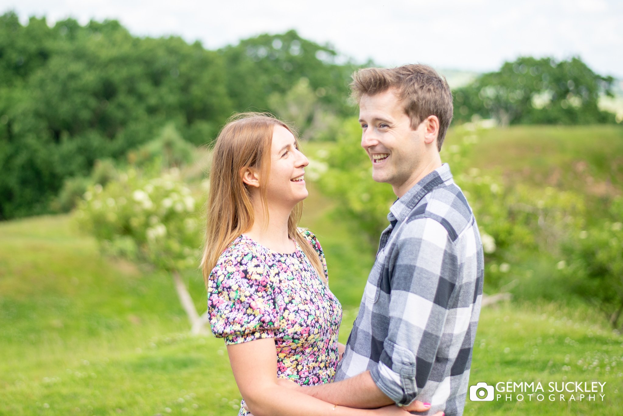 natural engagement photo of a couple at harewood house estate