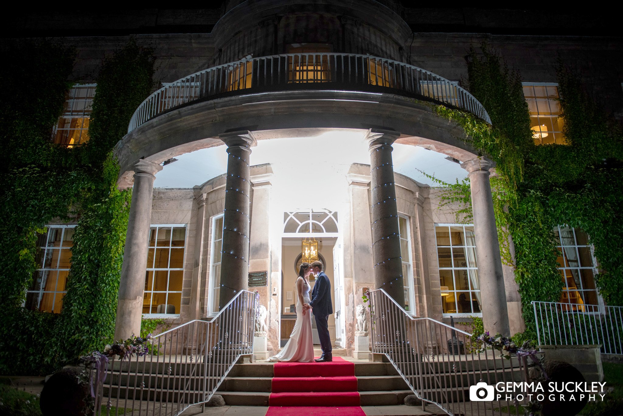 night photography of the bride and groom outside wood hall hotel 