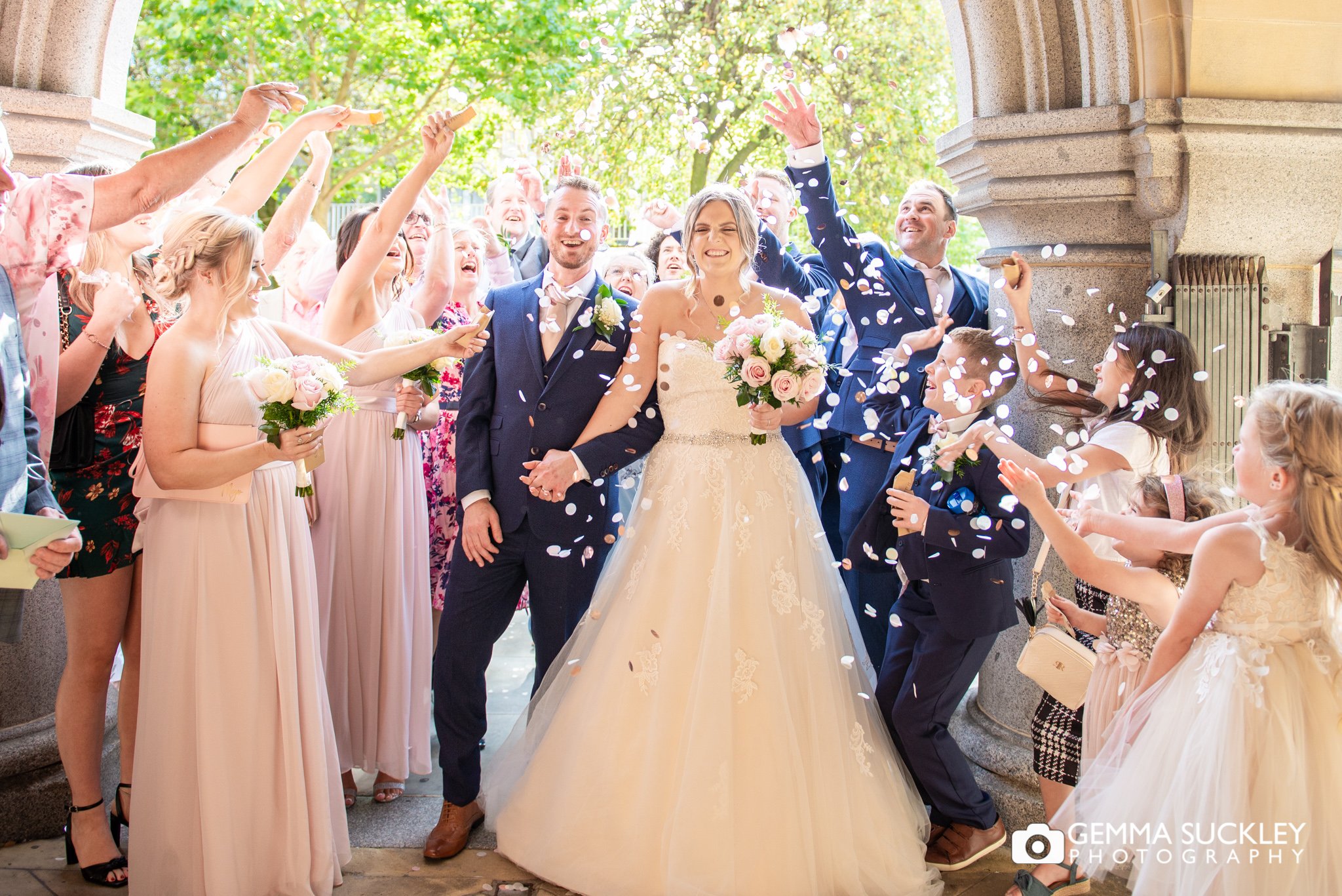 confetti being throw at the bride and groom outside bradford registry office 