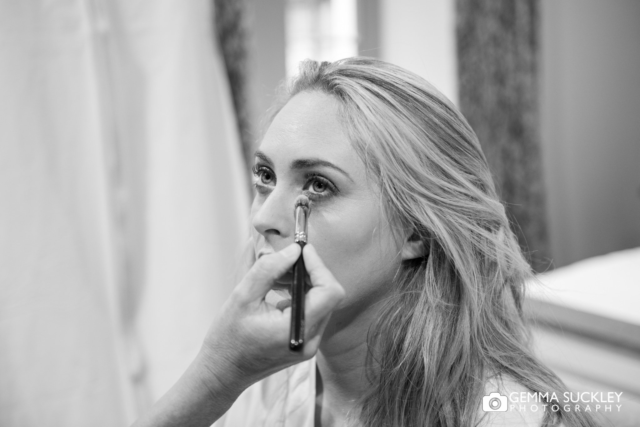 close up photo of a bride having make up applied