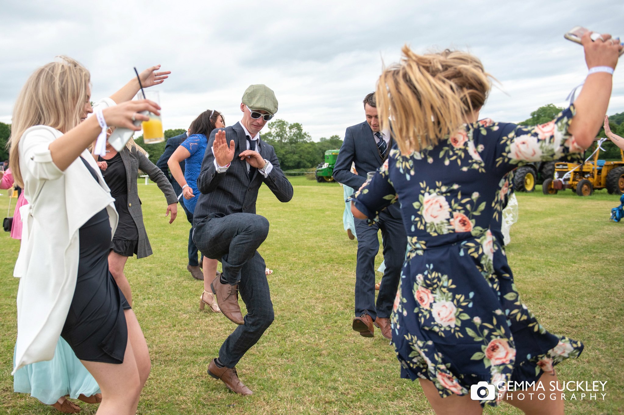 wedding guests enthusiastically dancing 