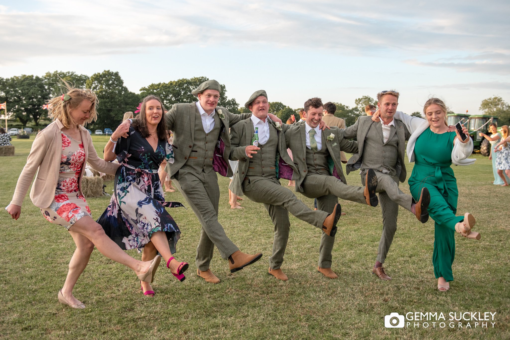 a group on wedding guests dancing at an outdoor wedding in clitheroe