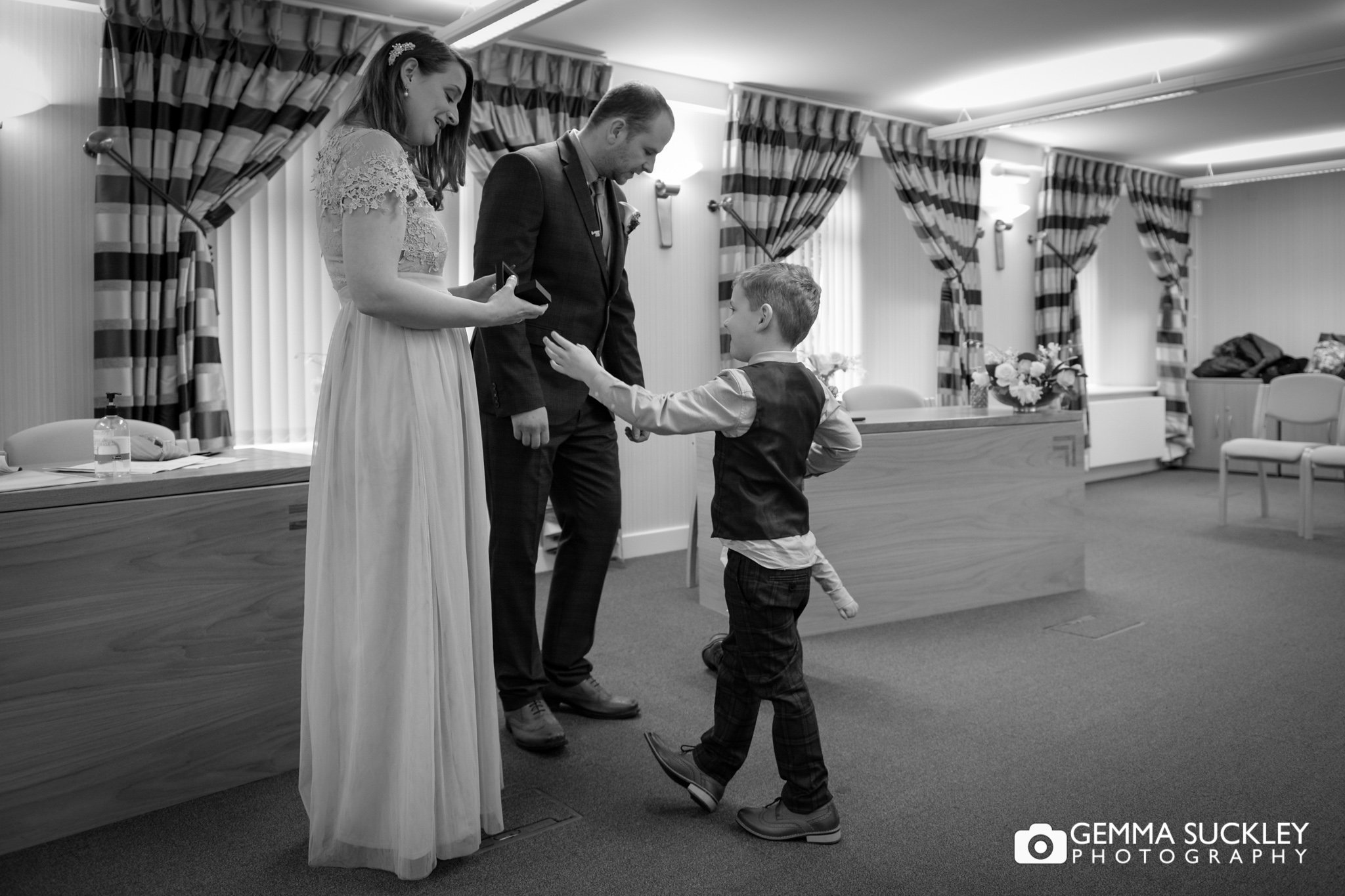 the pageboy delivers the ring to his dad at skipton registry office
