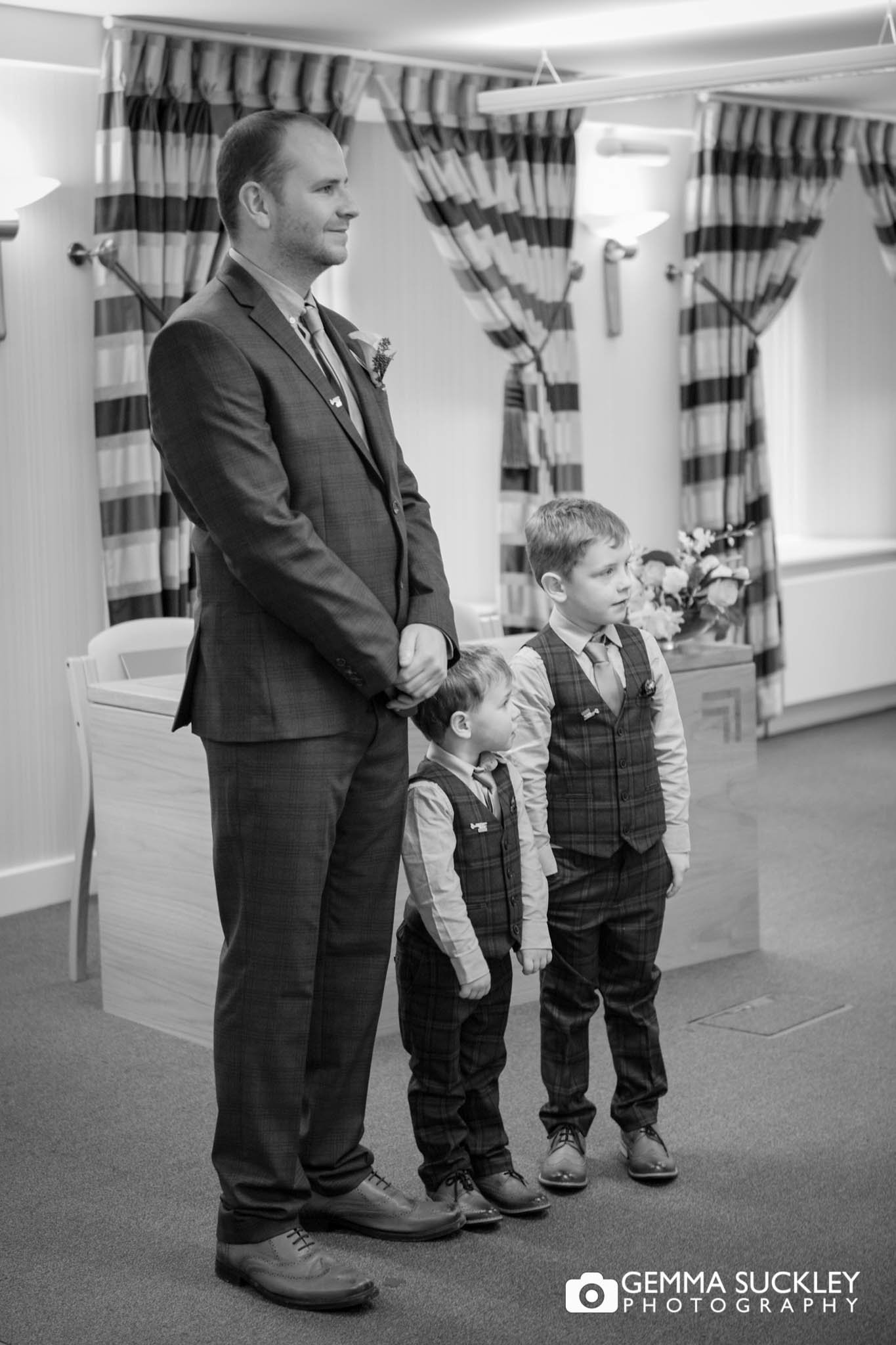 the groom and his two children waiting in skipton registry office