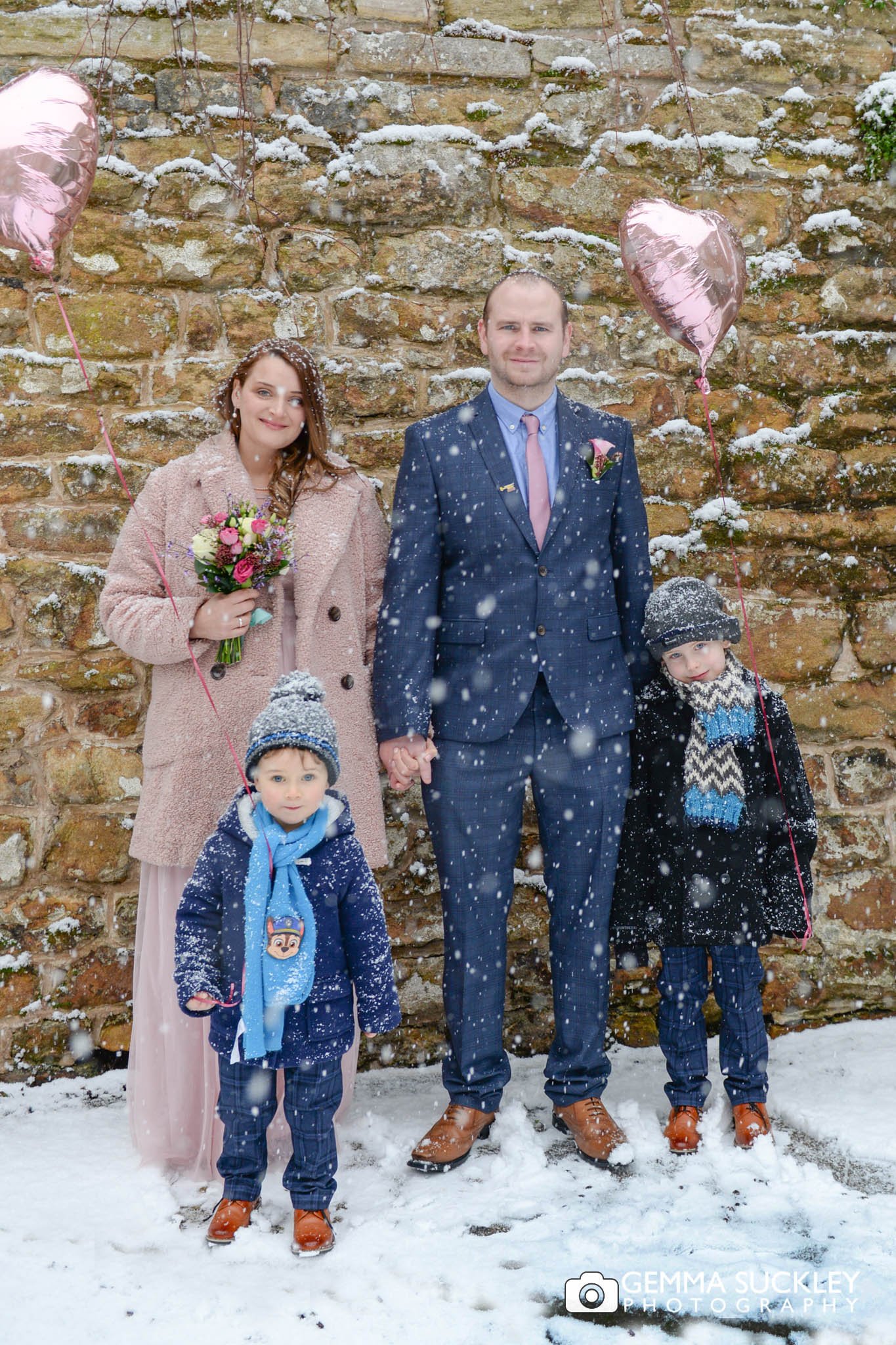 family wedding photo outside skipton registry office in the snow