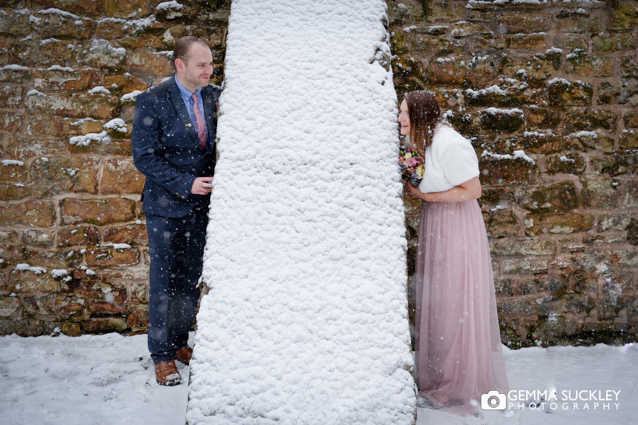 bride and groom wedding photo in the snow outside skipton registry office