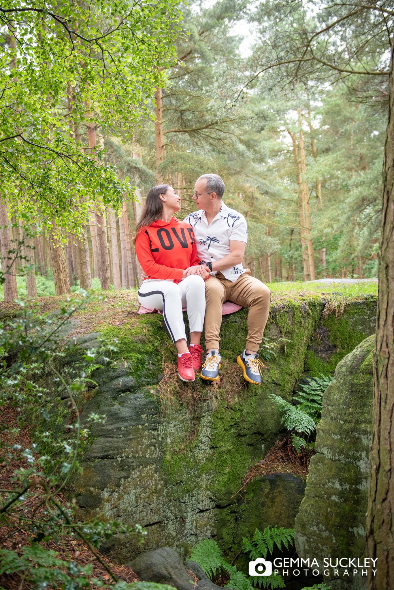 a couple sitting in cullingworth woods