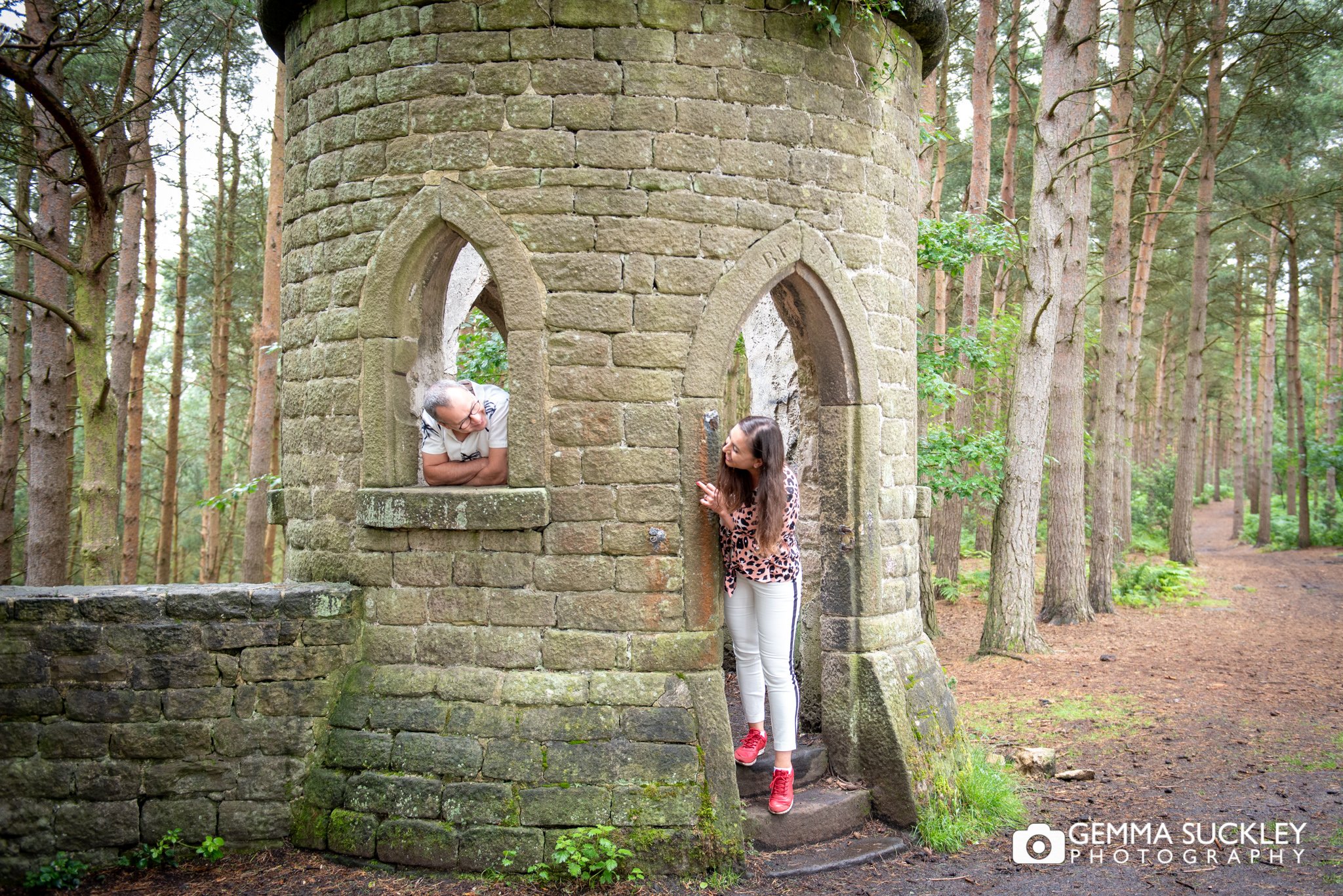 a couple standing in the folly in harden wood