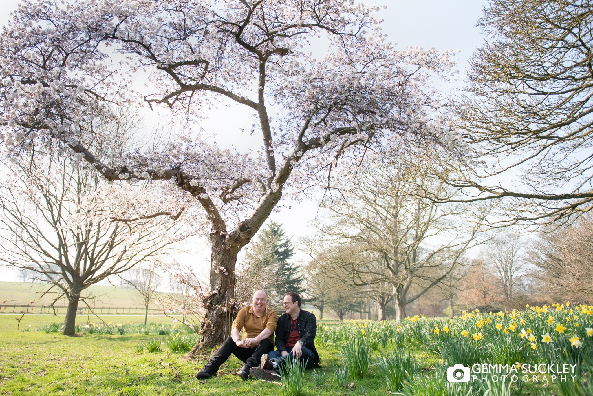 leeds engaged couple laughing during their engagement photo shoot at temple newsam