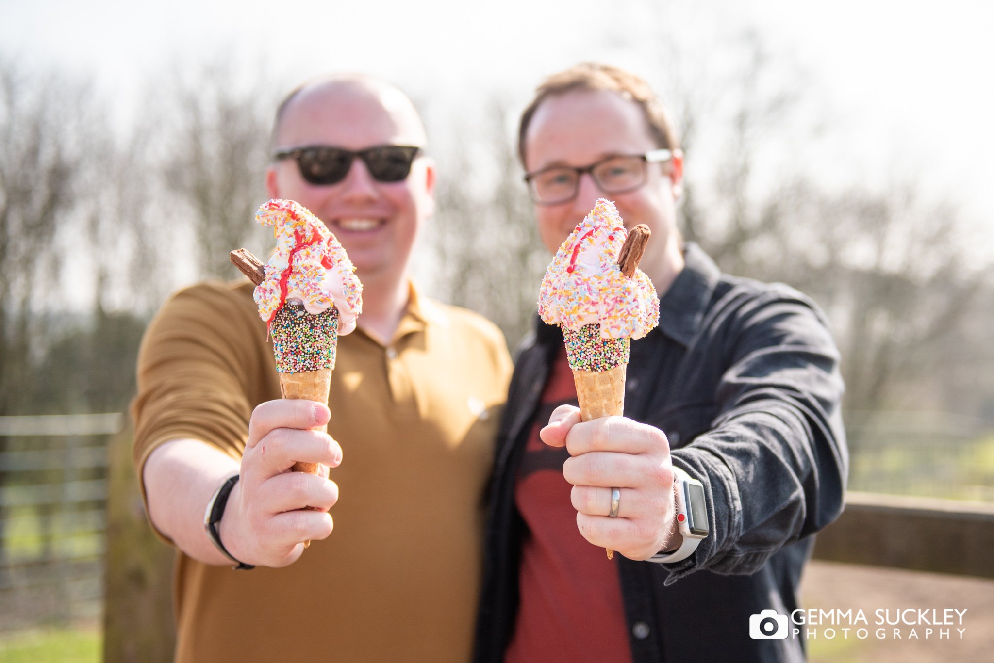 A couple holding out ice creams at temple newsam