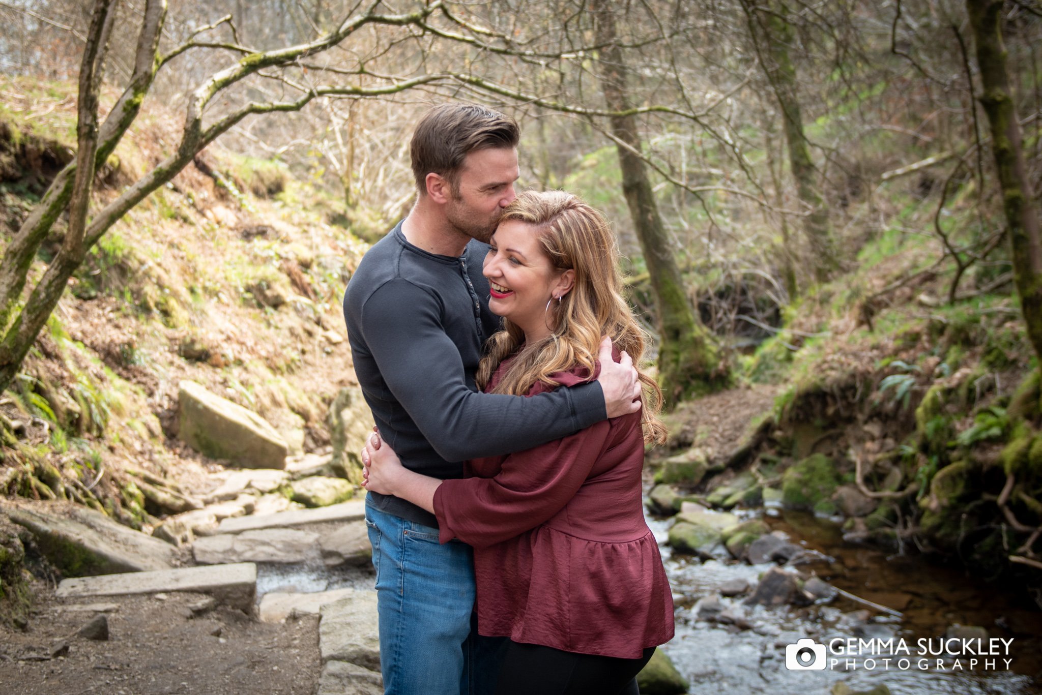 an engaged couple hugging during their pre-wedding photo shoot at ogden water