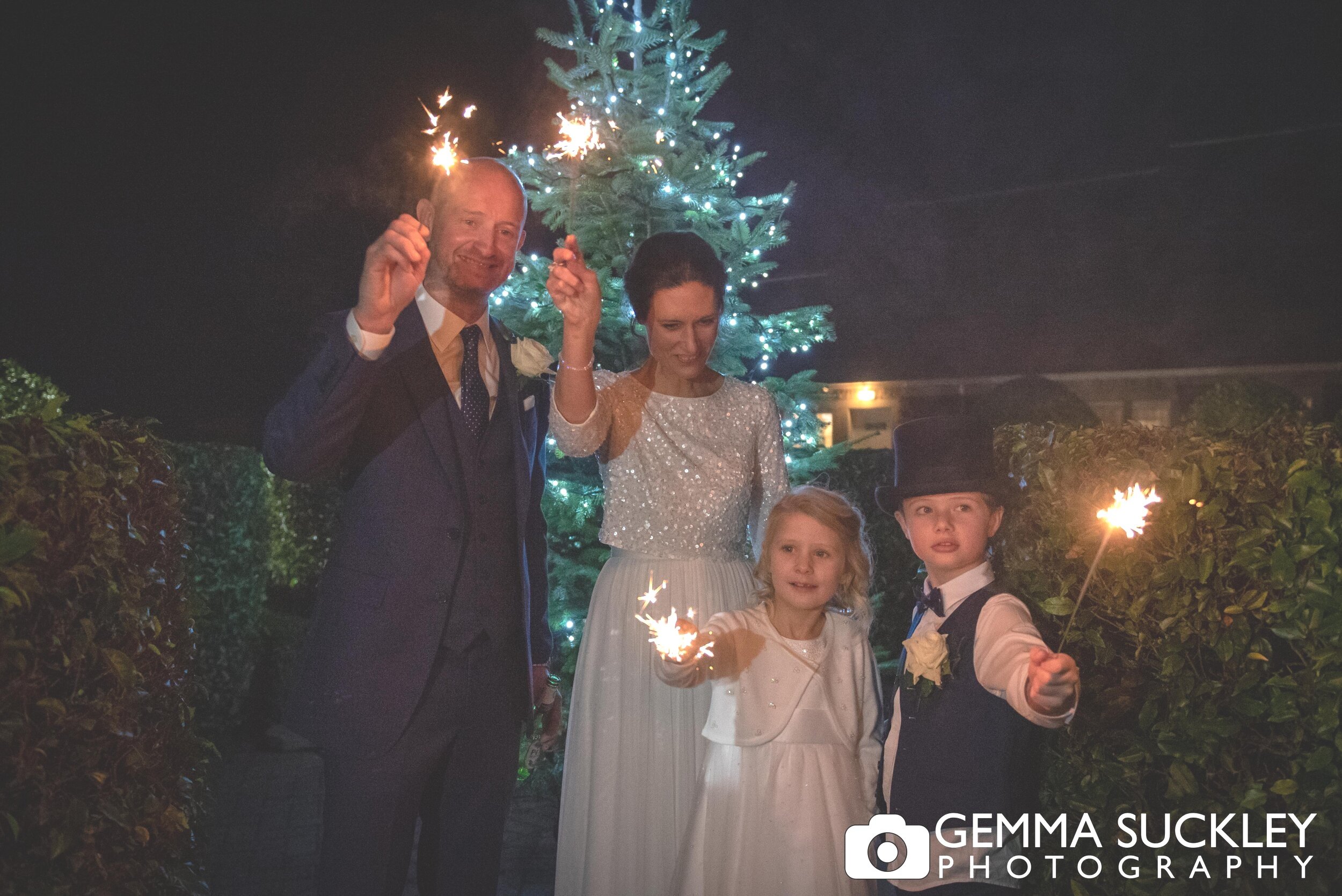 family with sparklers at the devonshire arms hotel wedding