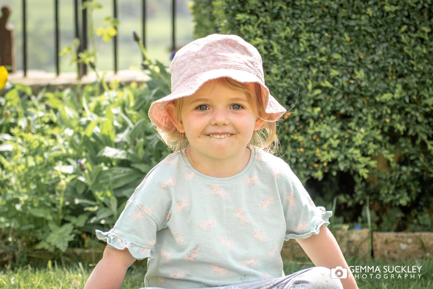 toddler portrait of a little girl in a sun hat