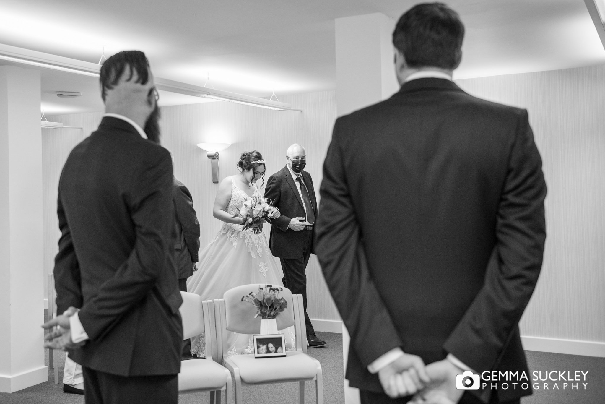a bride and her dad walking down the aisle at skipton registry office 
