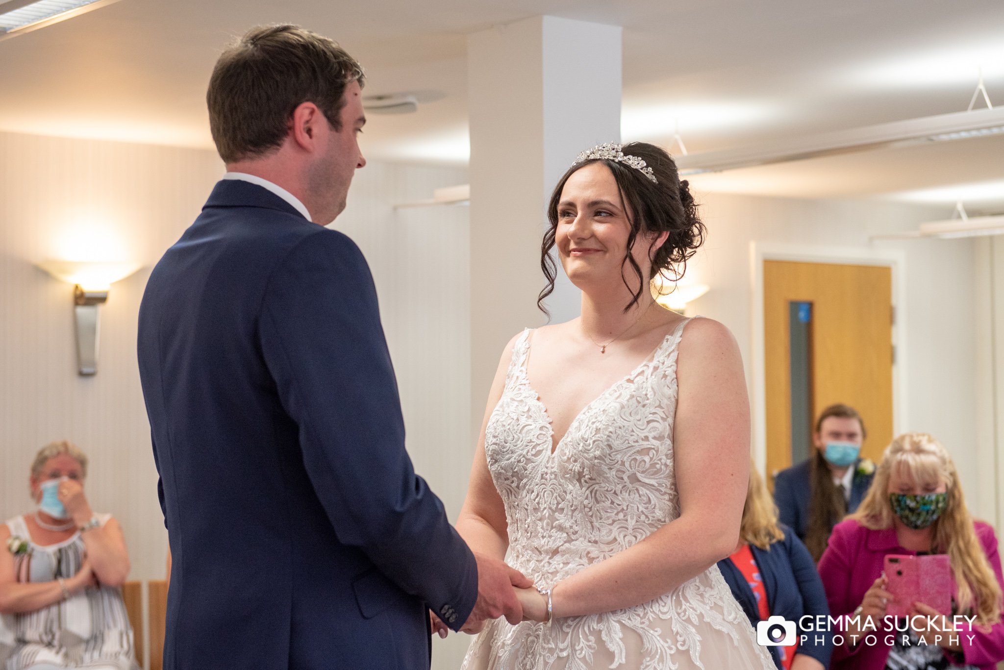 the bride and groom saying their vows at skipton registry office