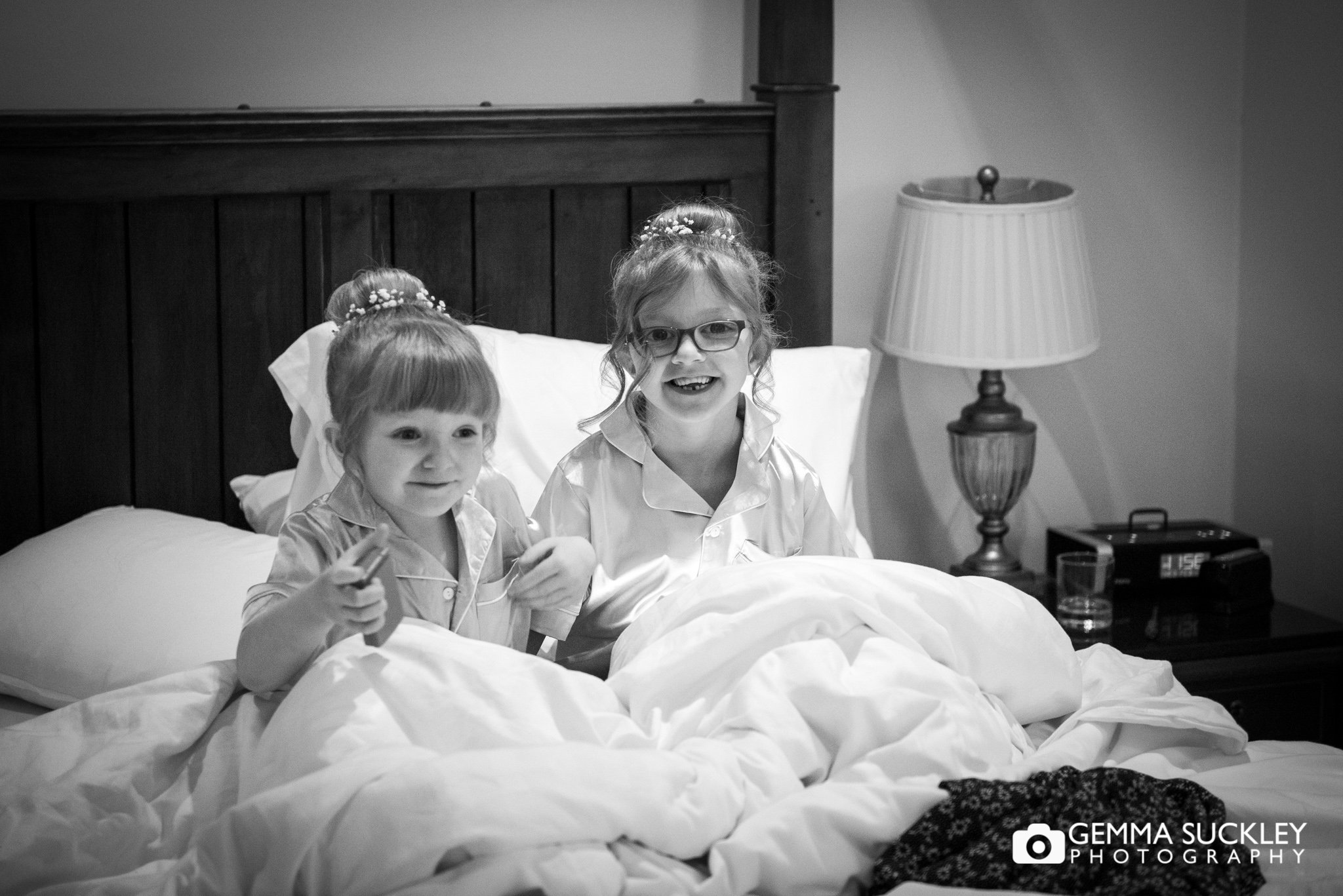 two flower girls in bed at hollins hall