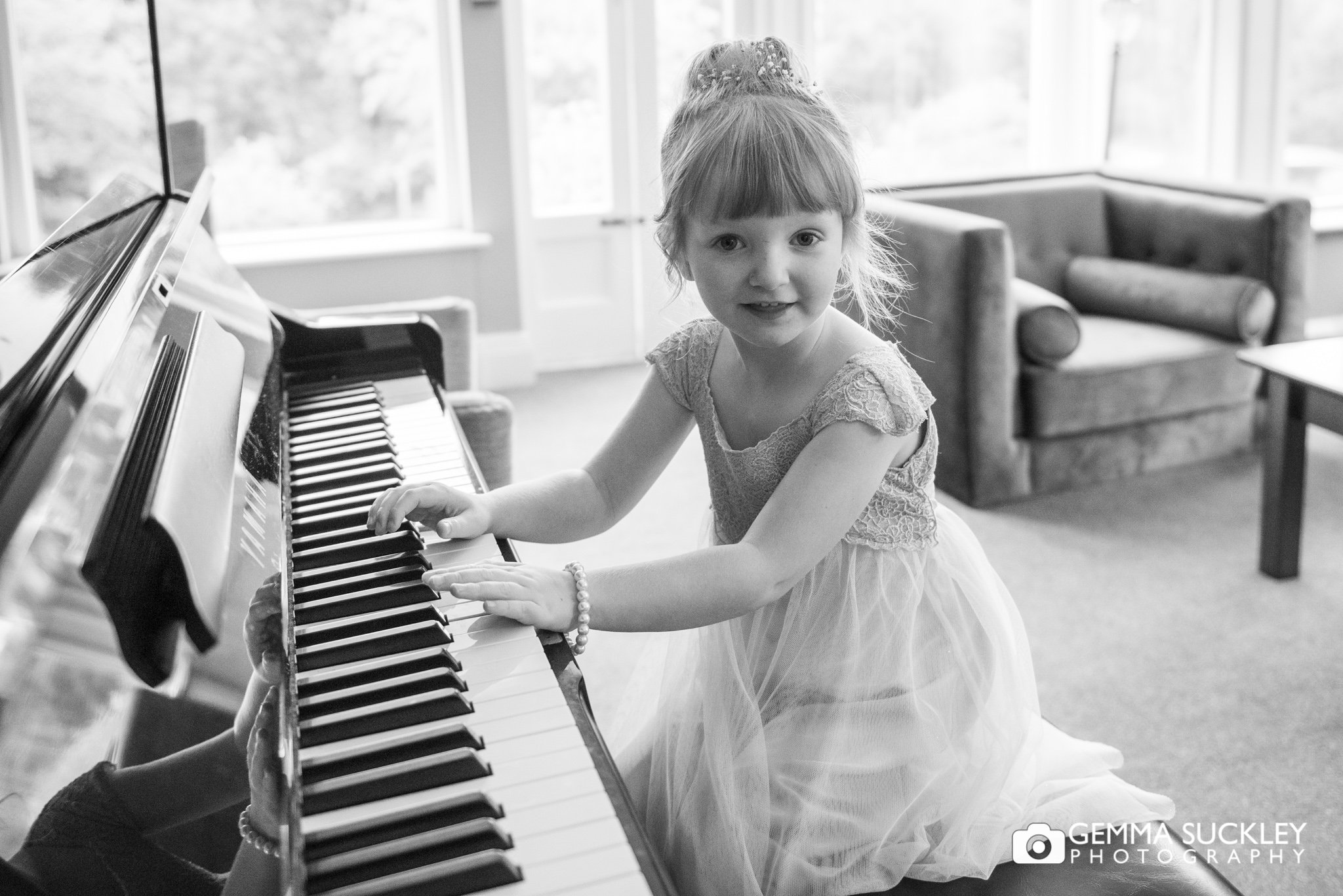 athe flower girl playing the piano at hollins hall