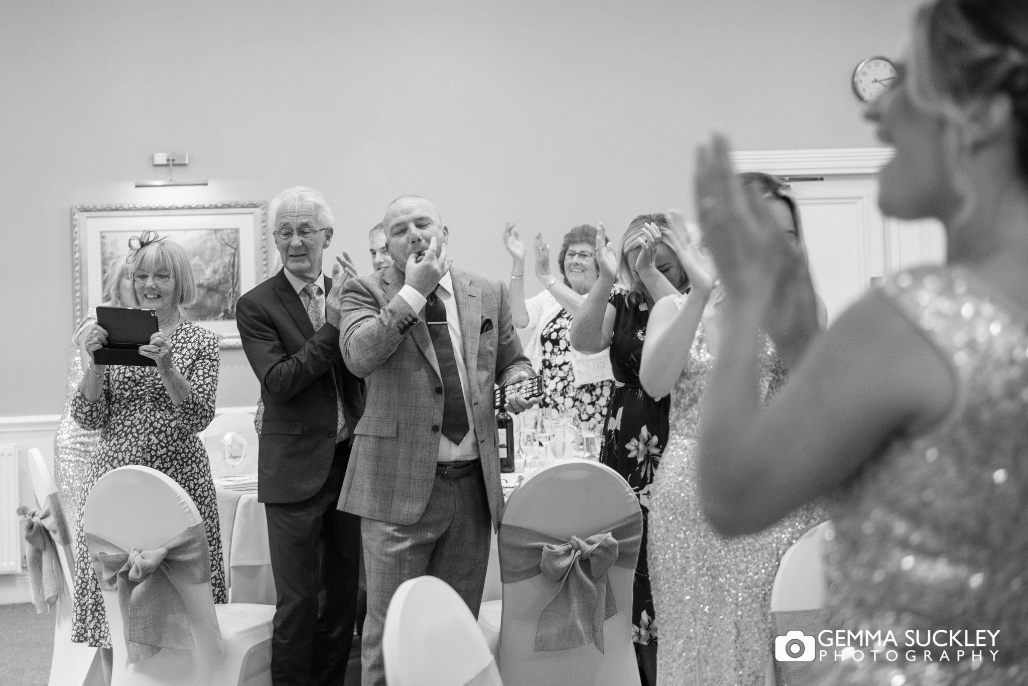 wedding guests clapping at hollins hall