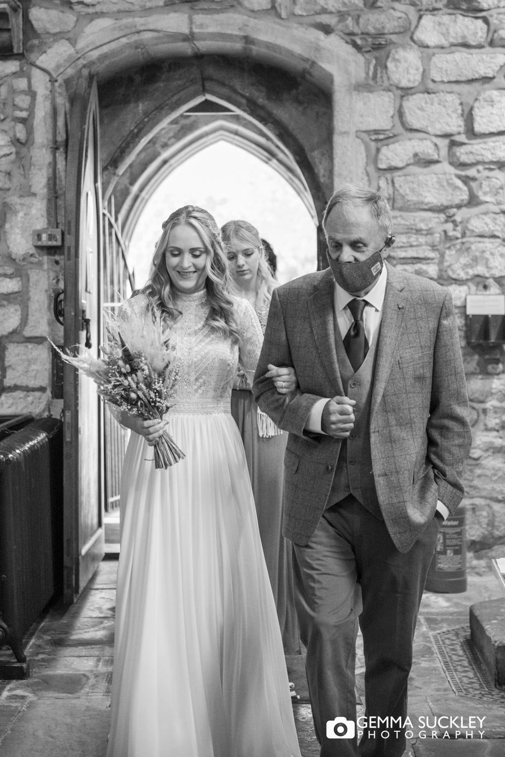 the  bride and her father walking down the aisle at linton church 