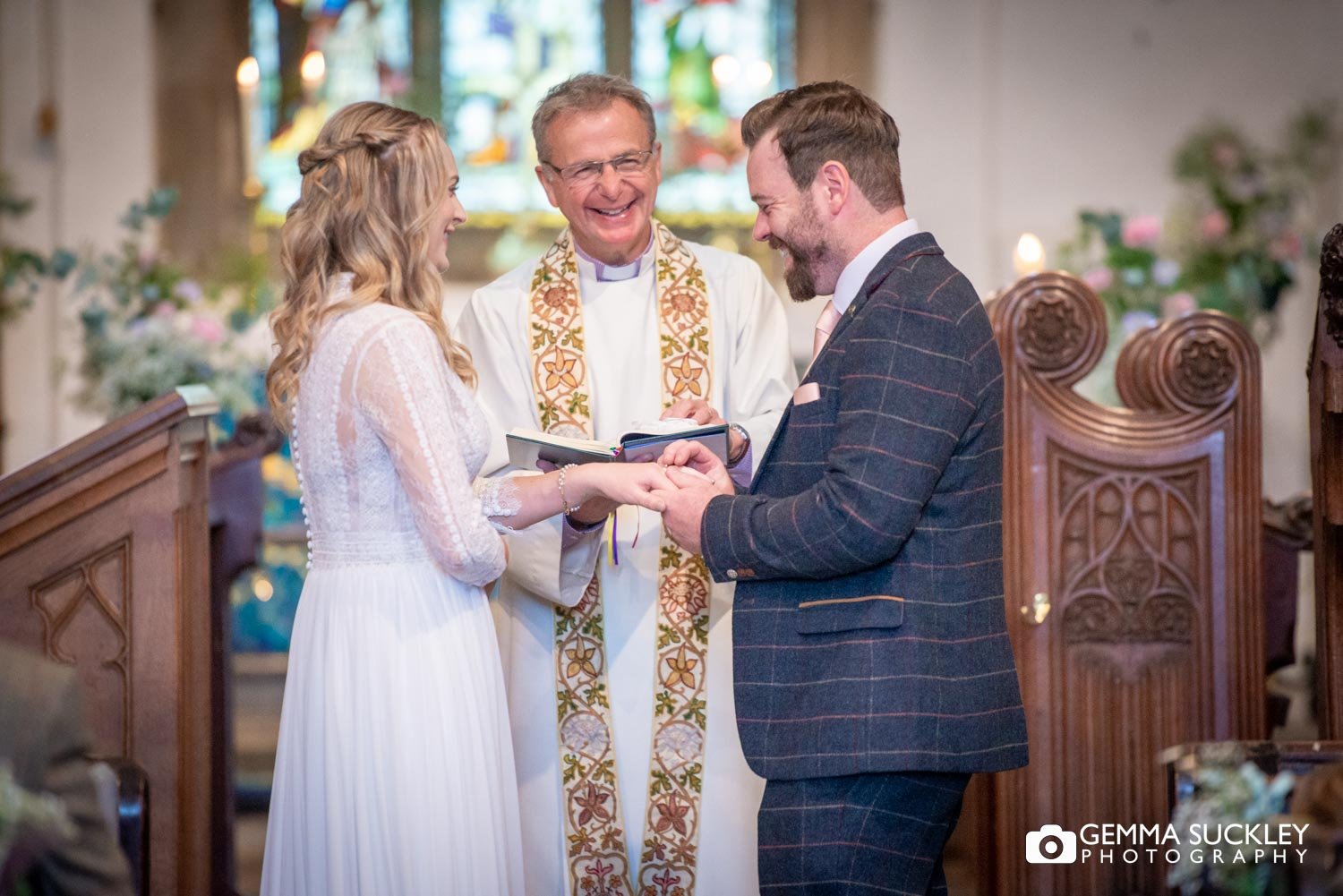 a groom struggling to put on his brides ring