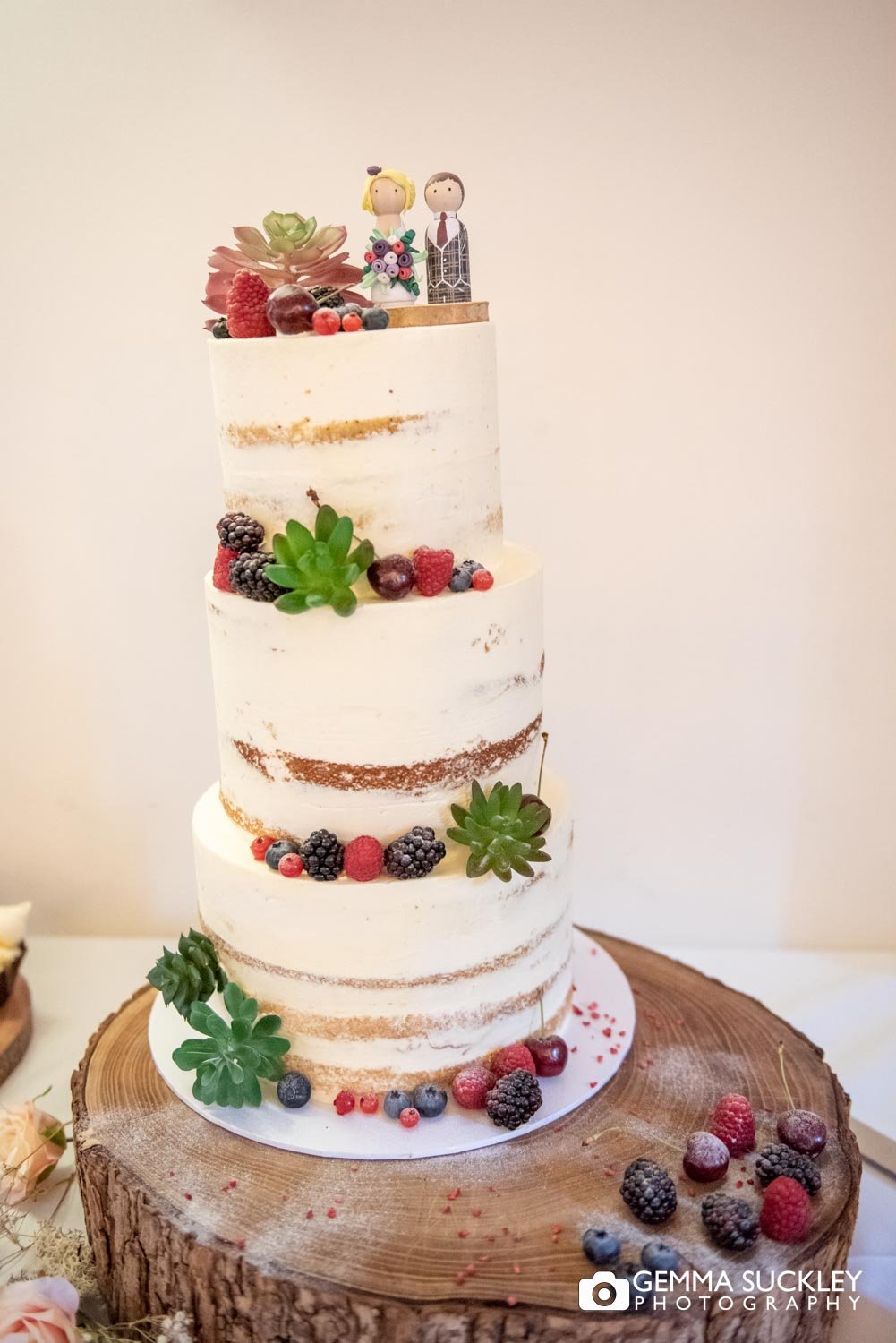 nude wedding cake with fruit detail