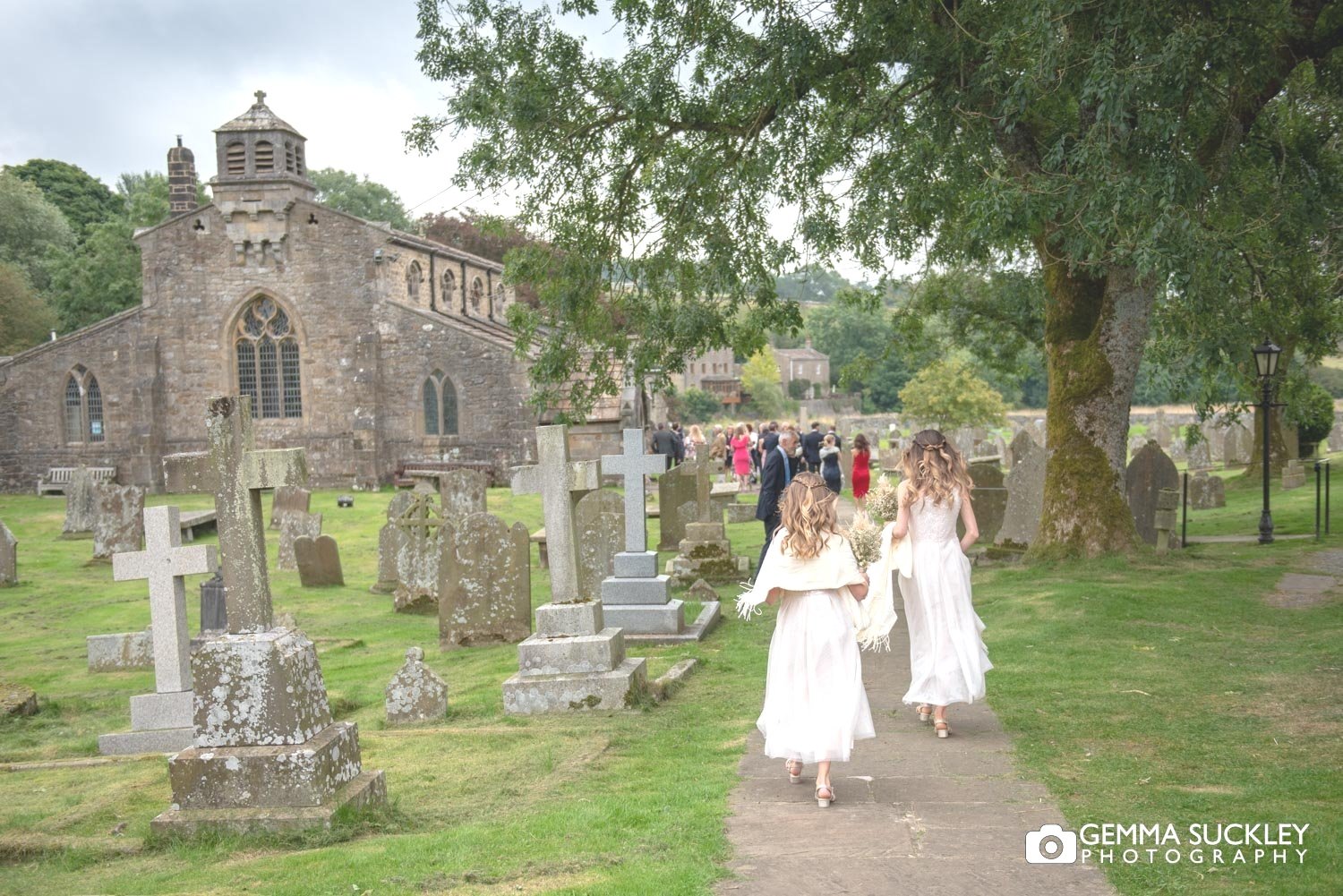 bridesmaids walking thought linton church yard