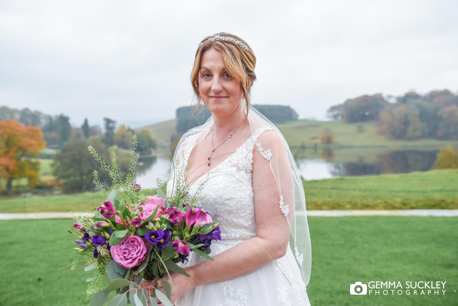 the bride at the coniston hotel with the lake behind
