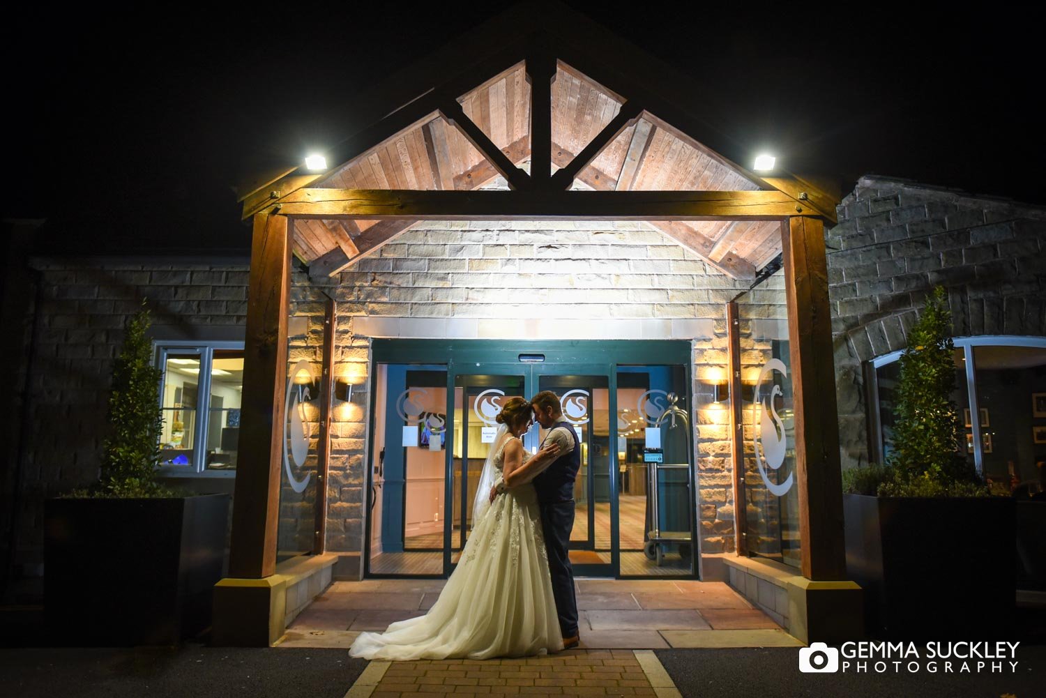 night photo of the bride and groom outside coniston hotel