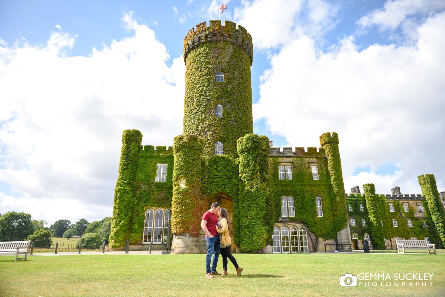 engaged couple in front of swinton castle