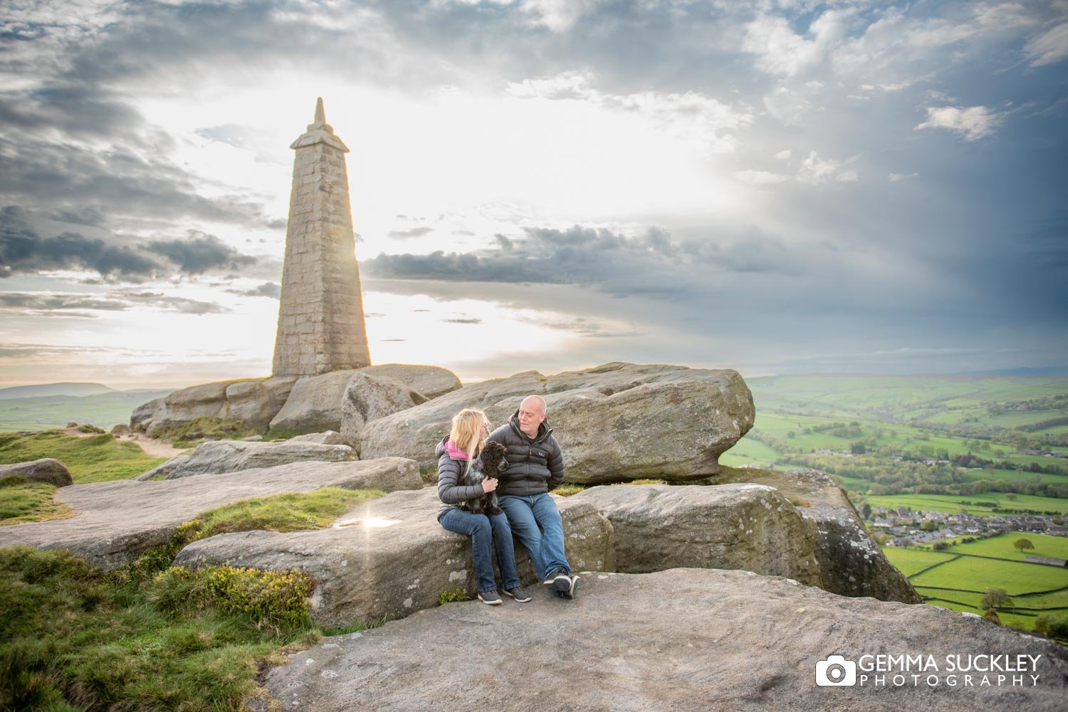 engaged couple at cowling pinnacle as the sun sets