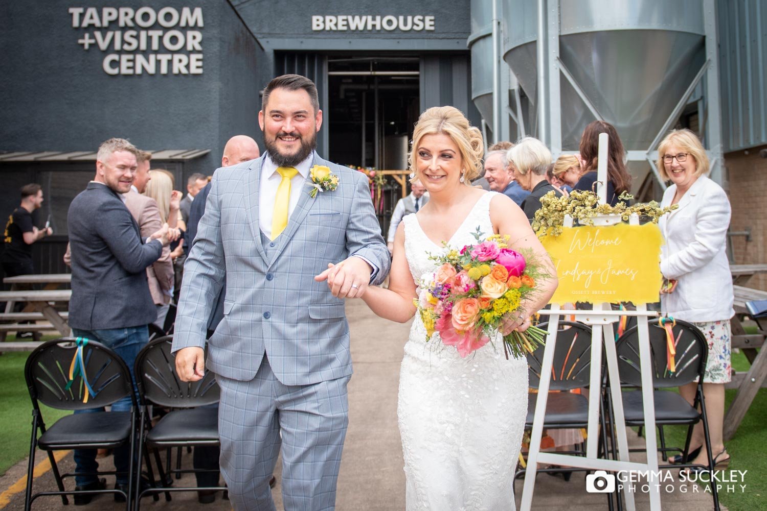 just married couple exiting ossett brewery 