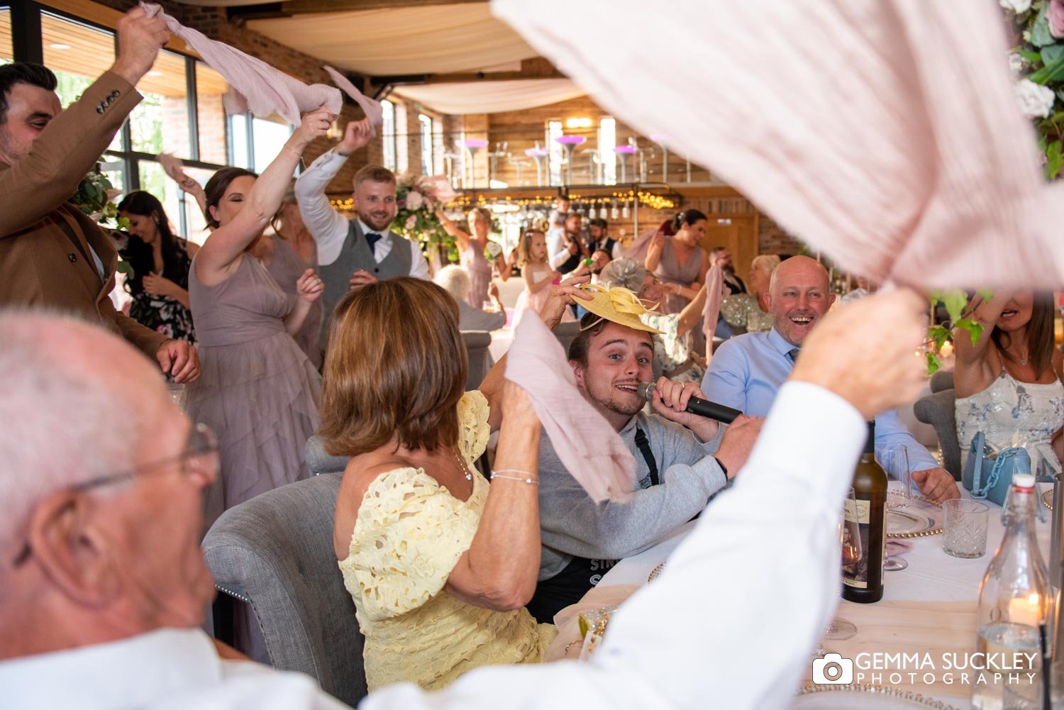 wedding guests waving their serviettes