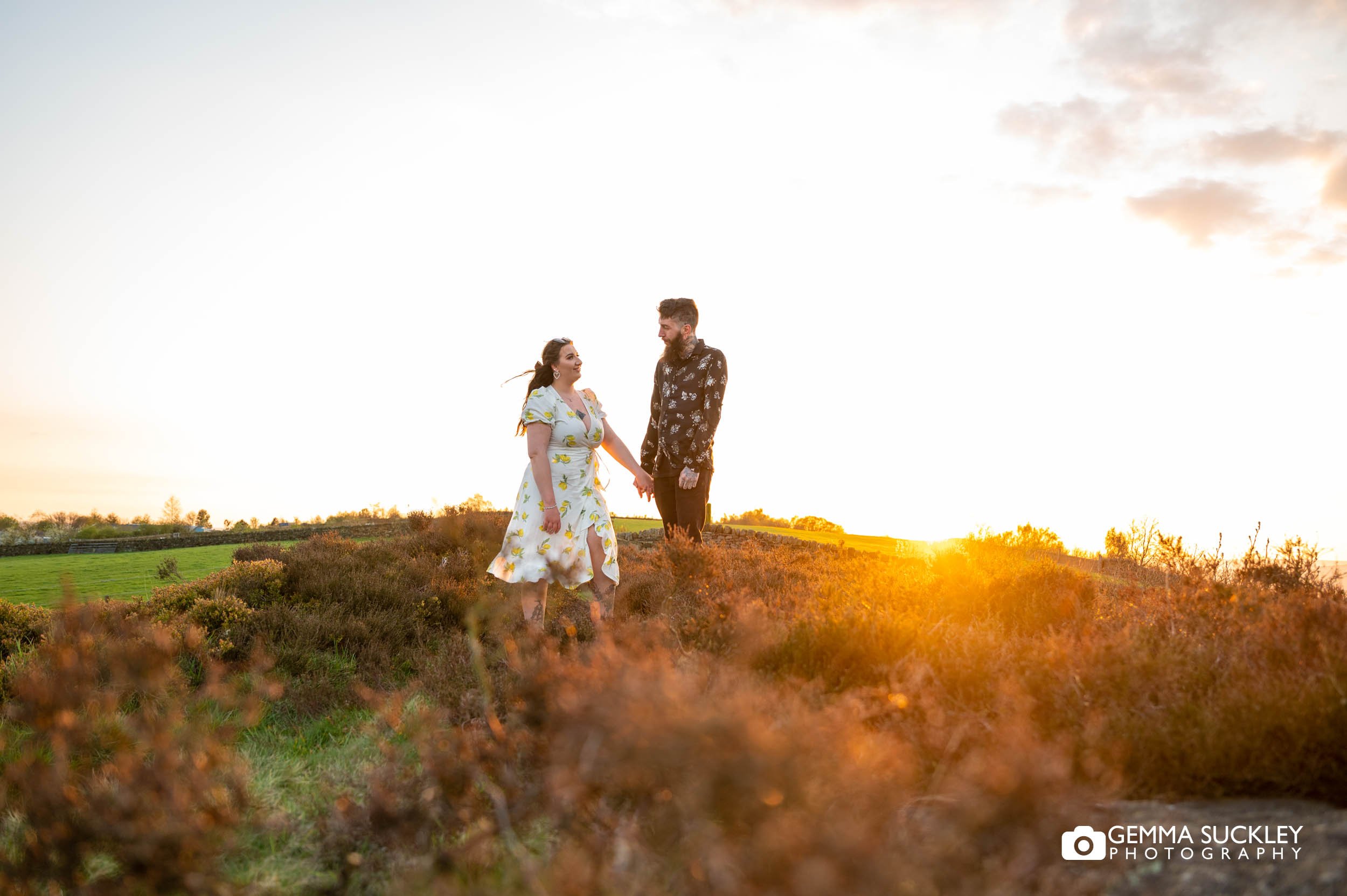 engaged couple at golden hour on otley chevin