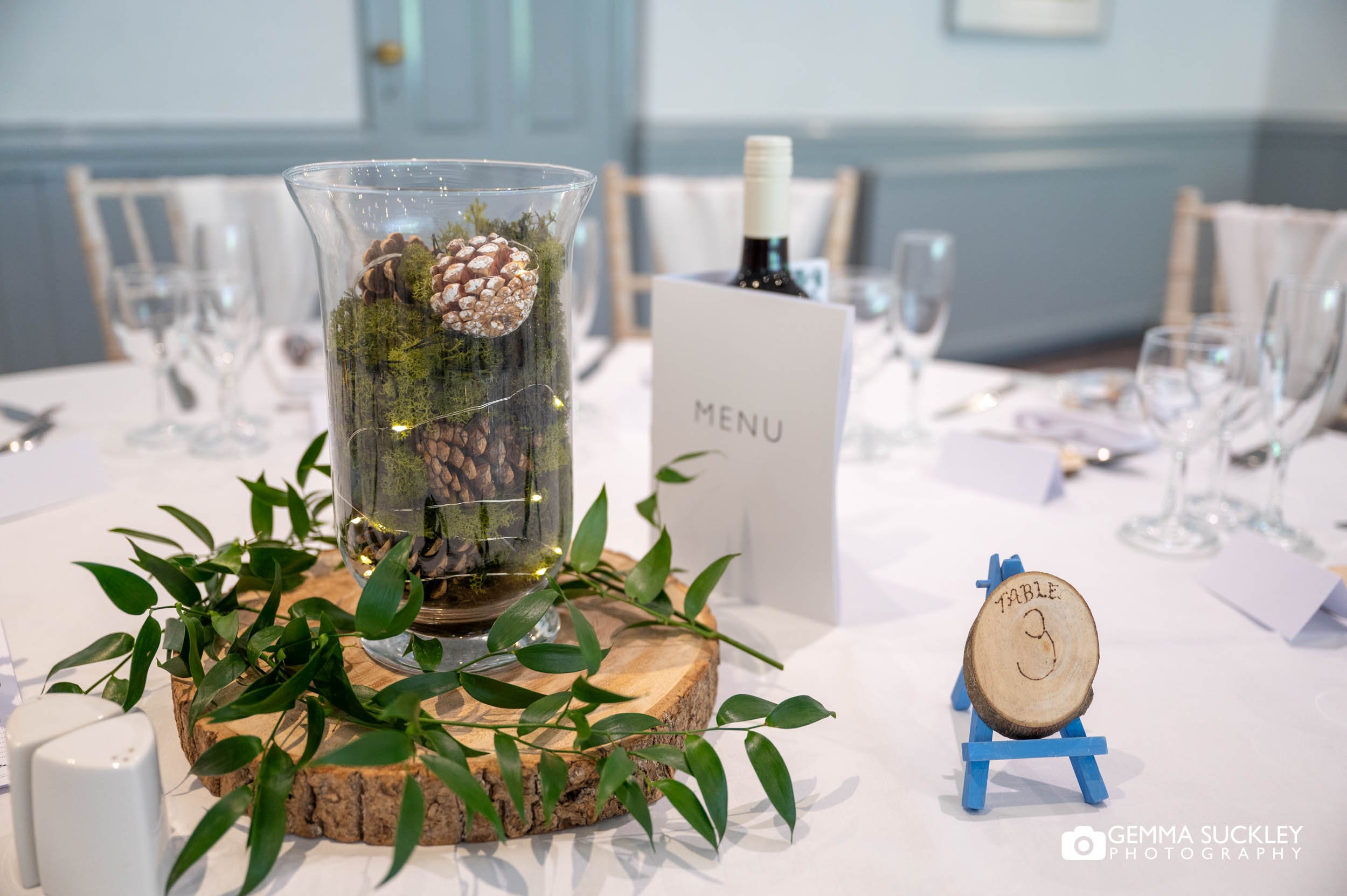 woodland based table centre piece at otley chevin weddding