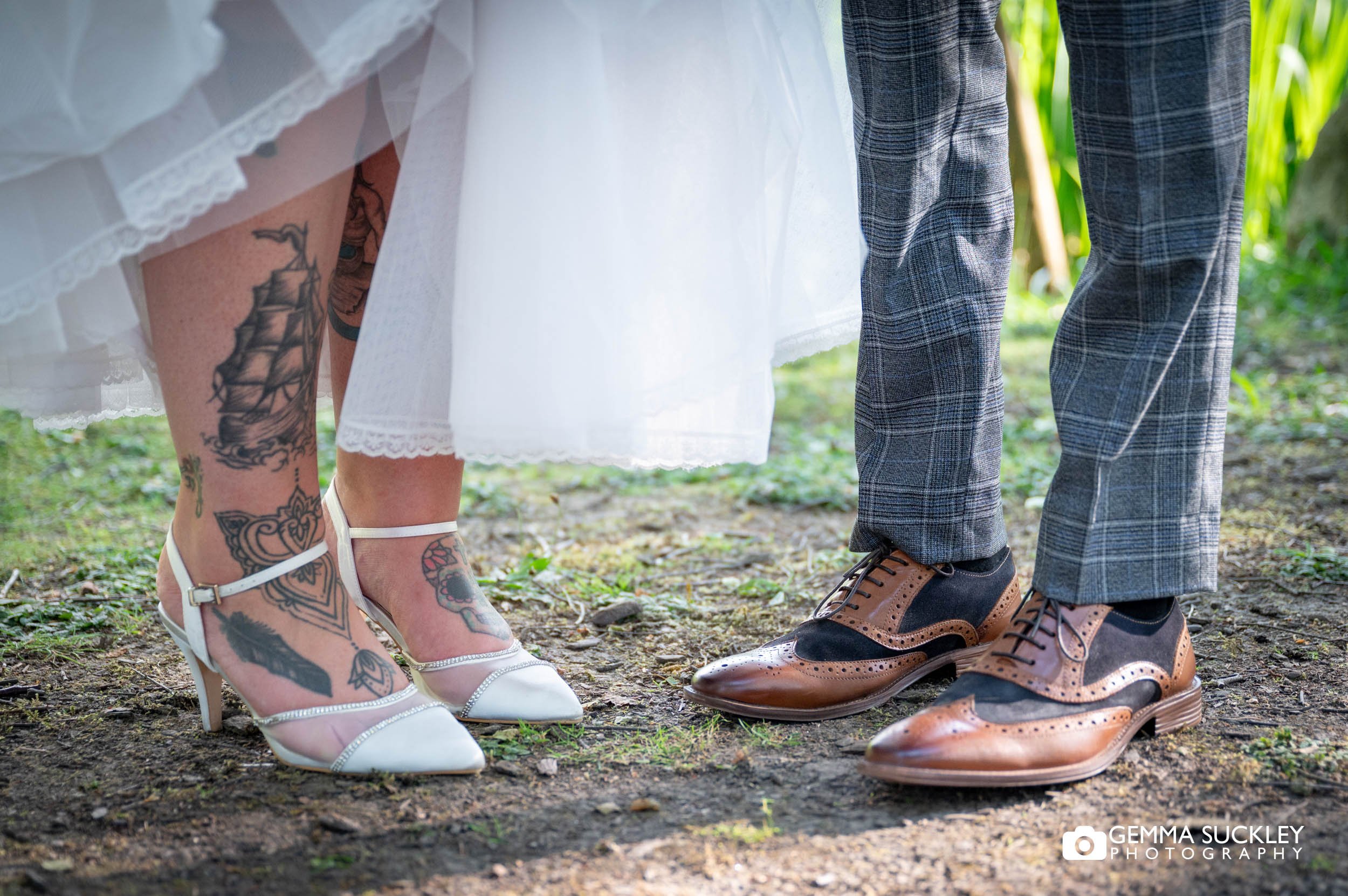 bride and grooms wedding shoes