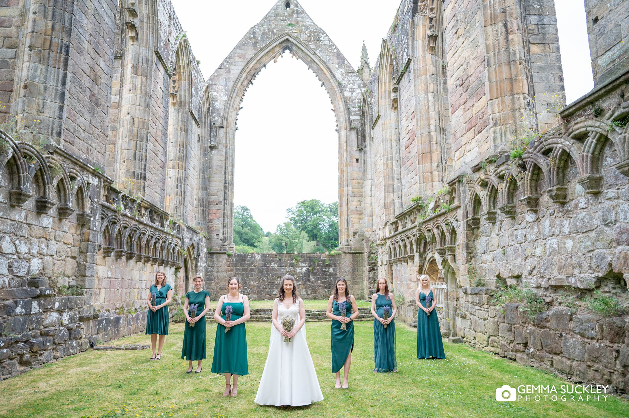 bride and bridesmaid at bolton abbey ruins