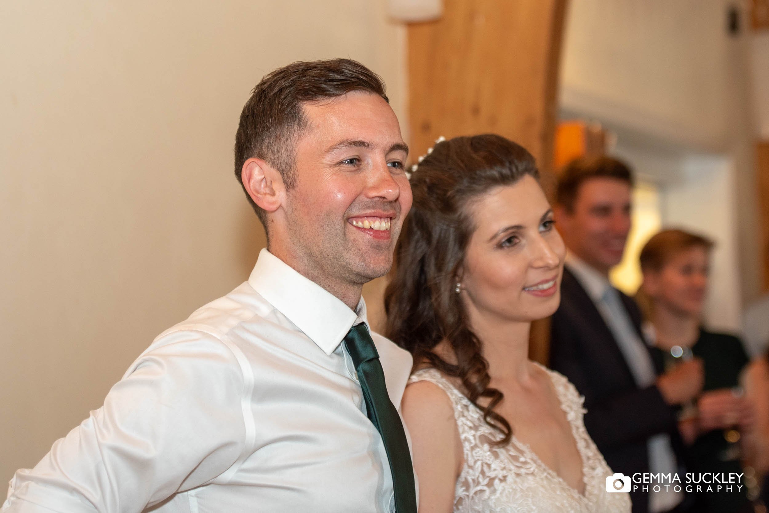 bride and groom listening to speeches at bolton abbey wedding