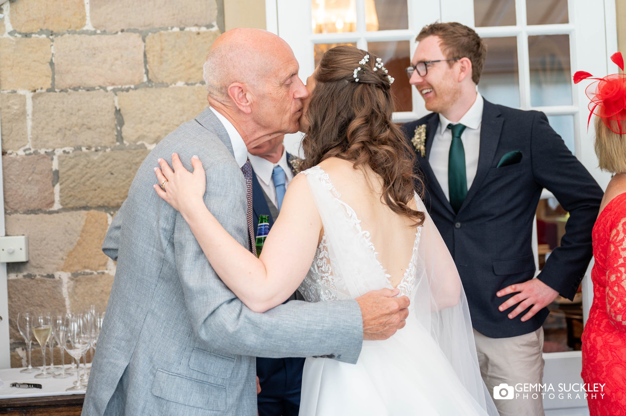 a wedding guest hugging the bride at devonshire arms hotel