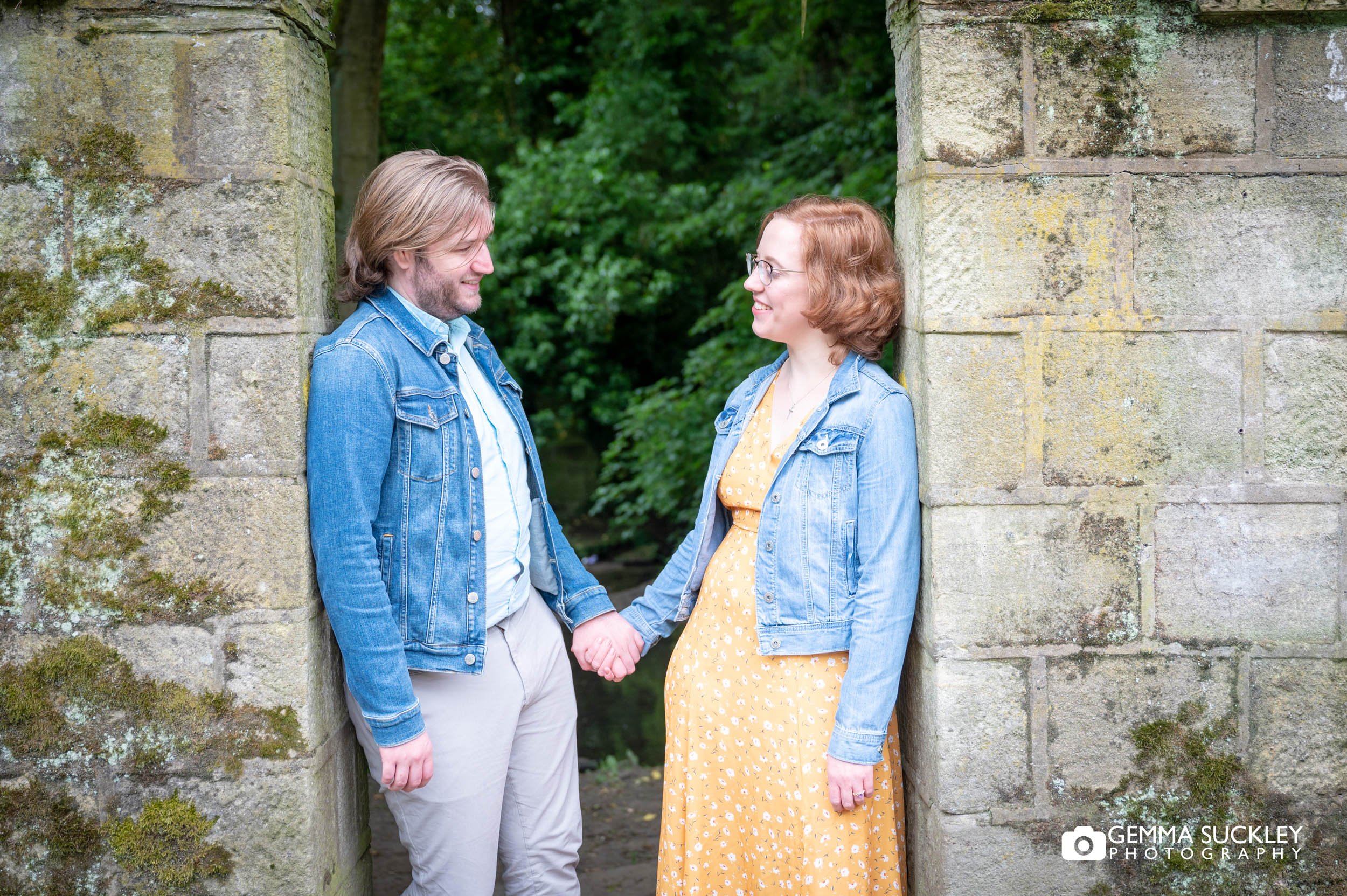 engaged couple in an arch way in Meanwood Leeds