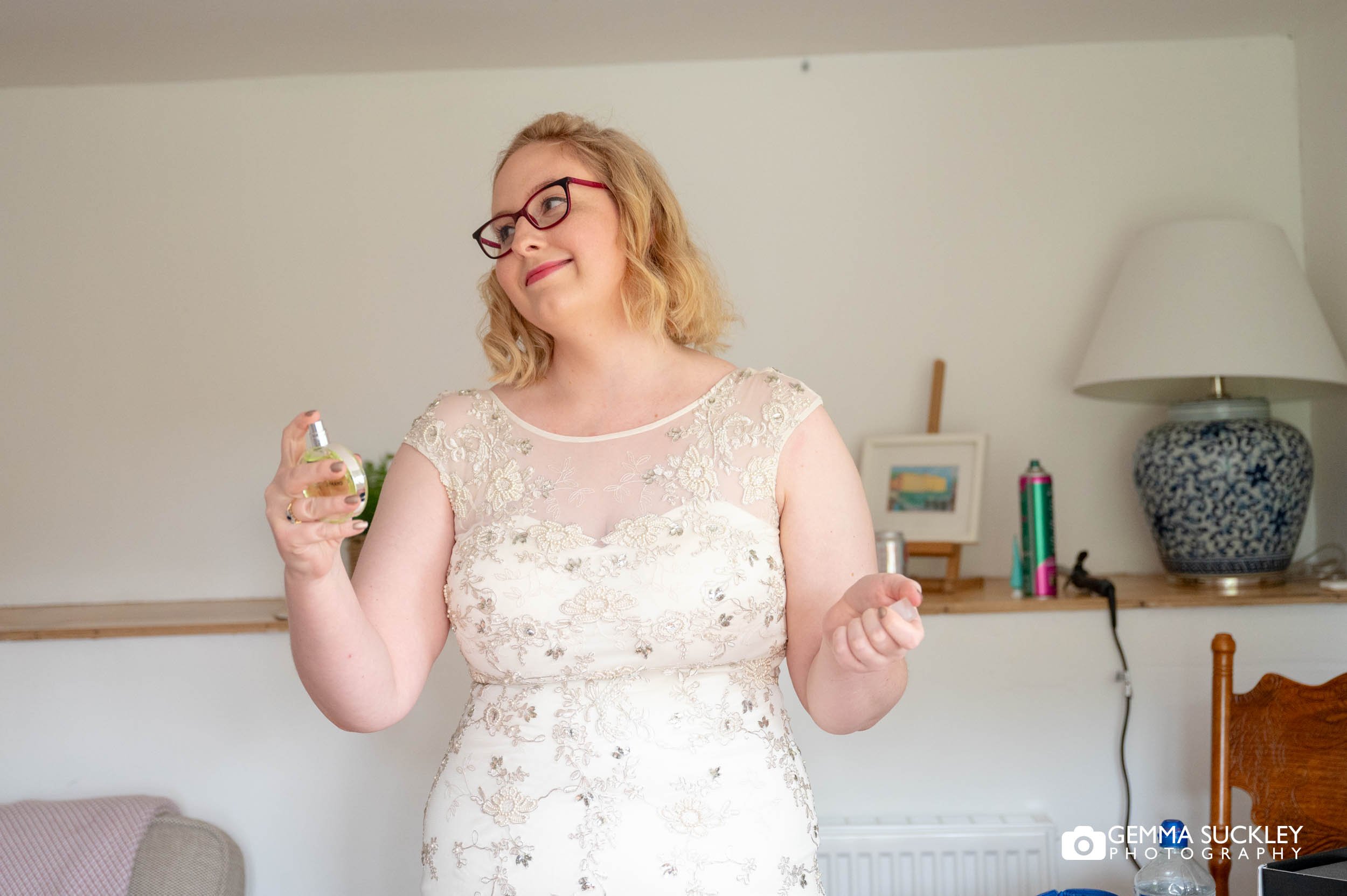 bride spraying perfume 