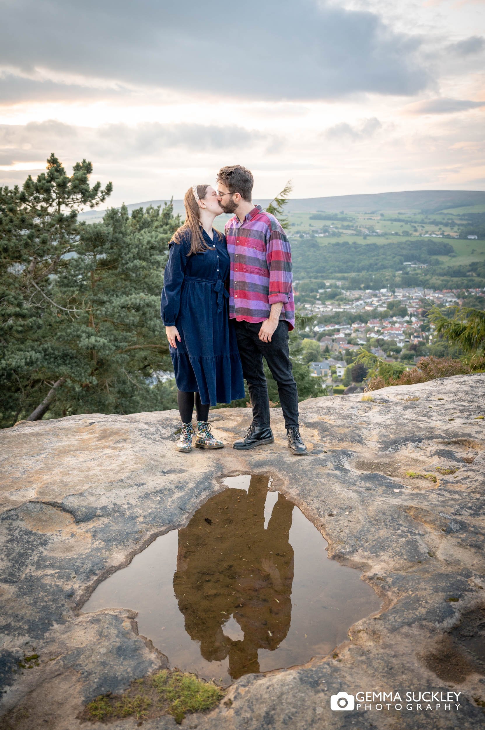 engaged couple kissing on ilkley moor