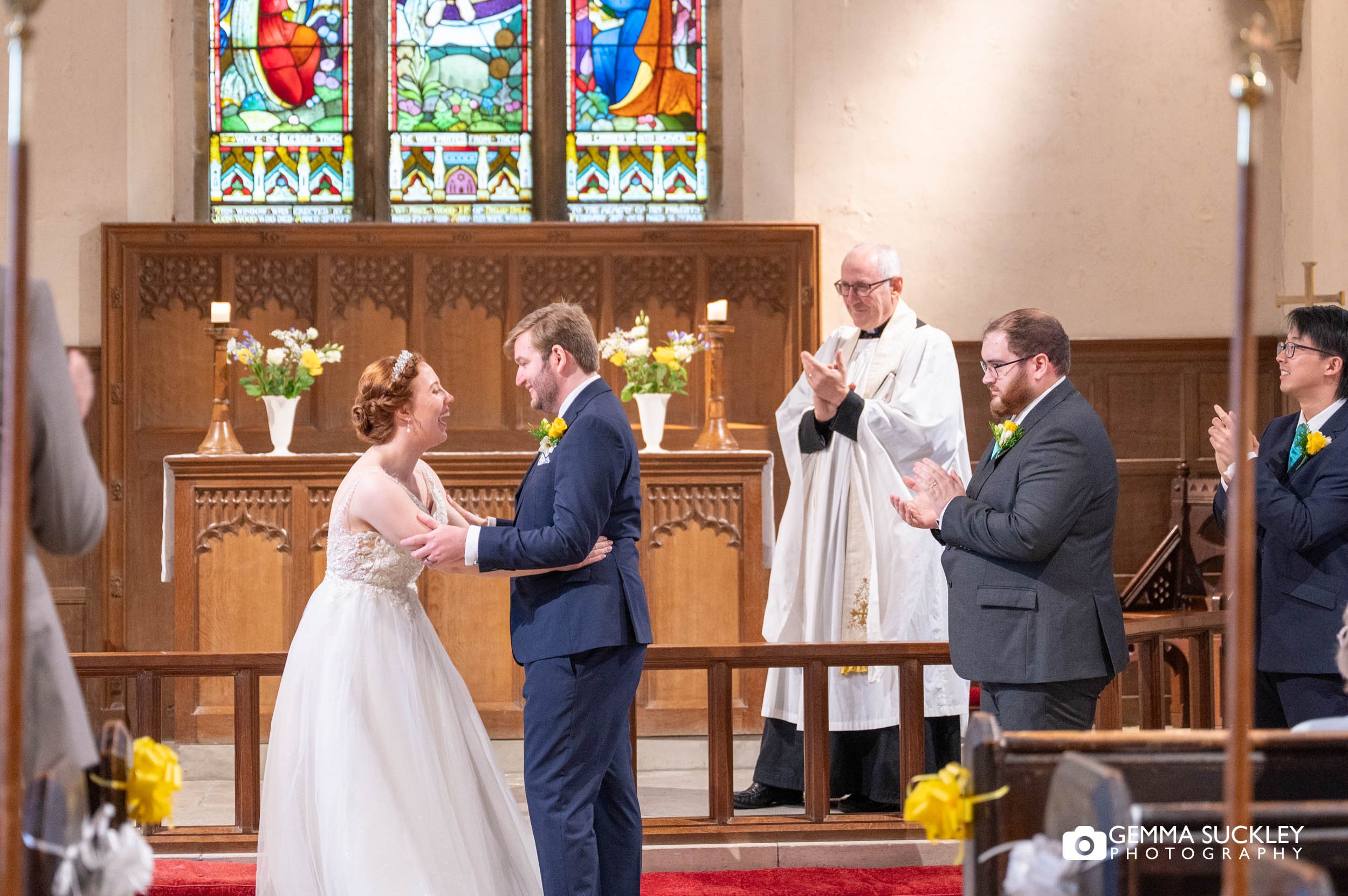 bride and groom laughing during the wedding ceremony