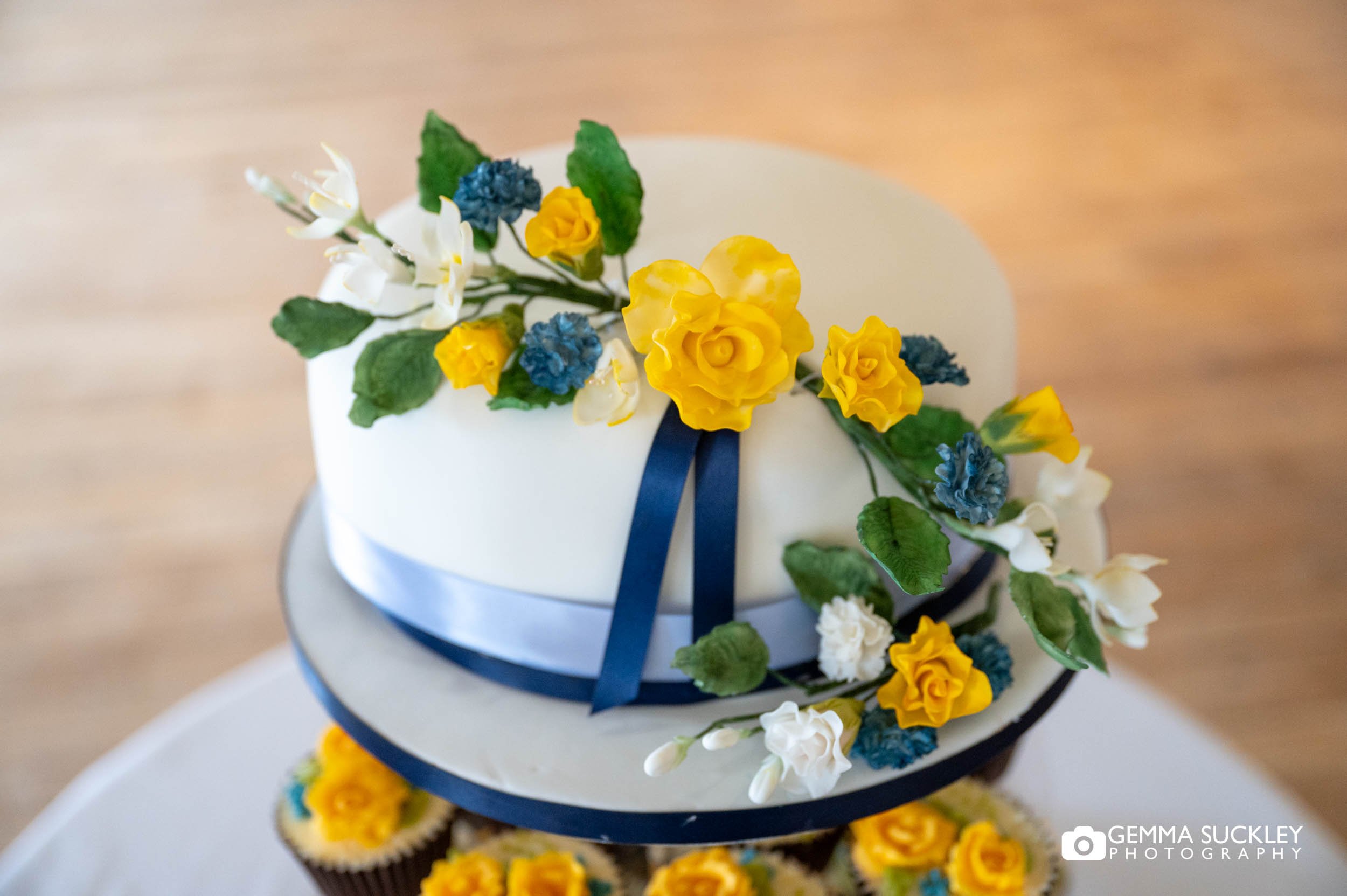 wedding cake with blue and yellow detail