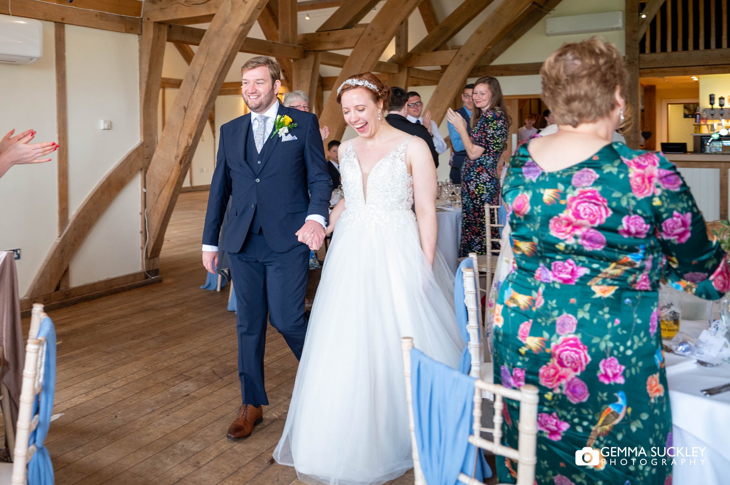 bride and groom enter the room at sandburn hall