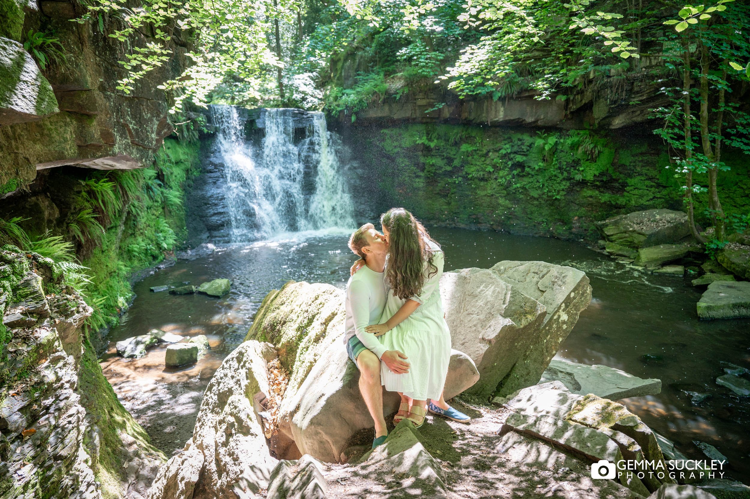 a kissing couple at goit stock waterfall