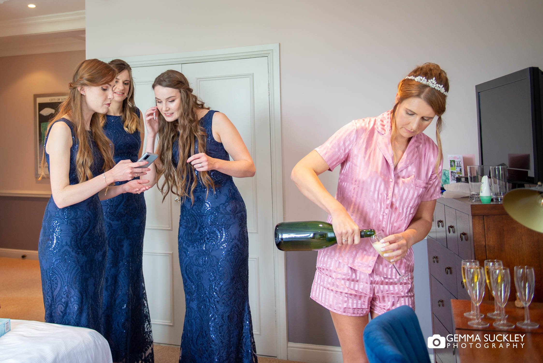 bride to be pouring champagne