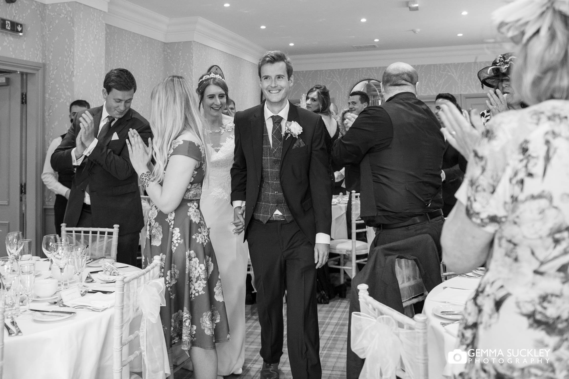 the newly weds entering the room at the devonshire fell hotel