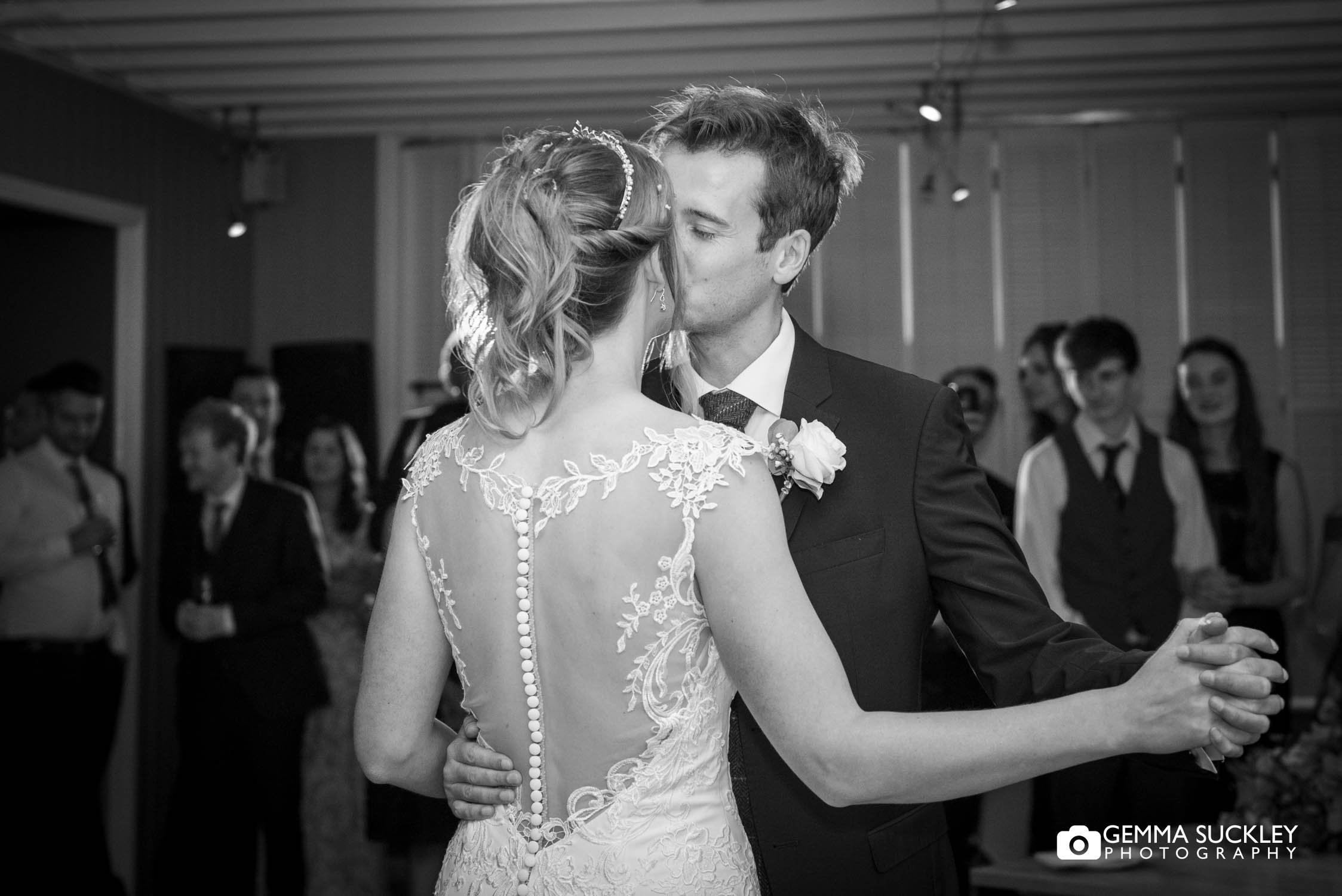 newly weds kissing during their first dance