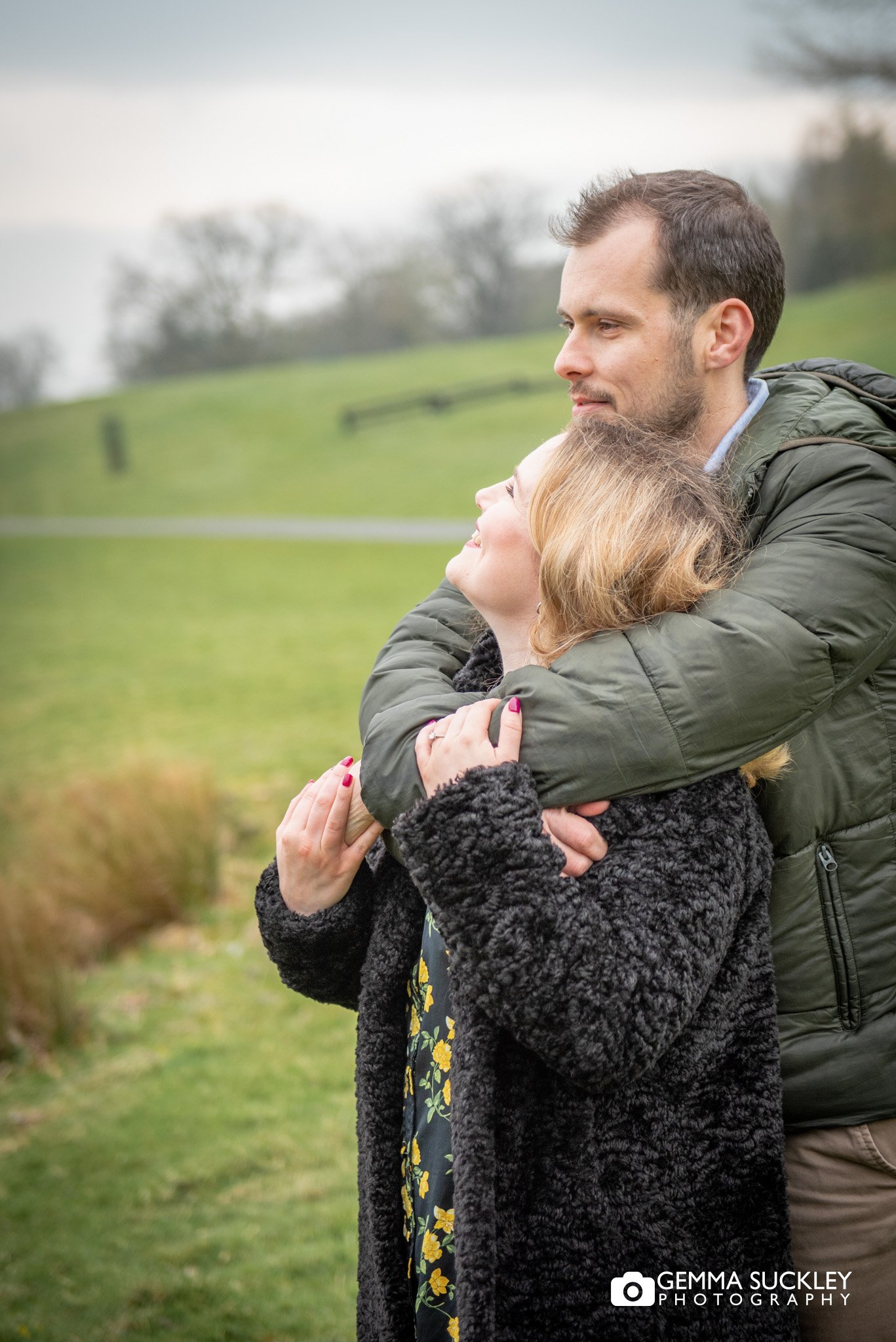 hugging engaged couple at coniston lake in skipton