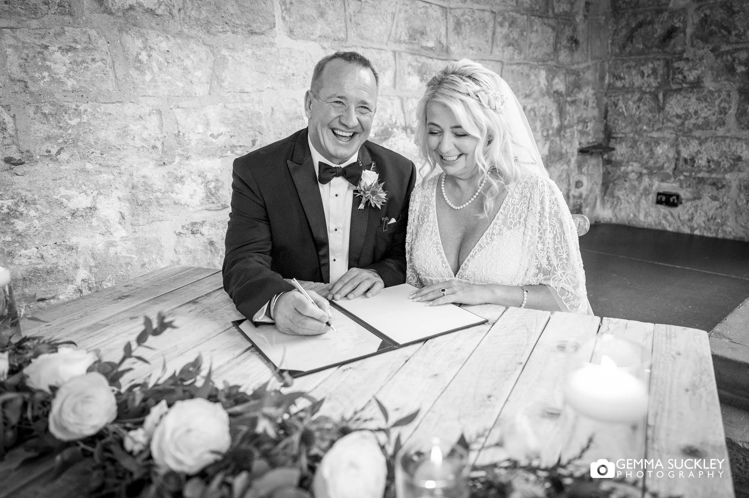 just married couple signing the register
